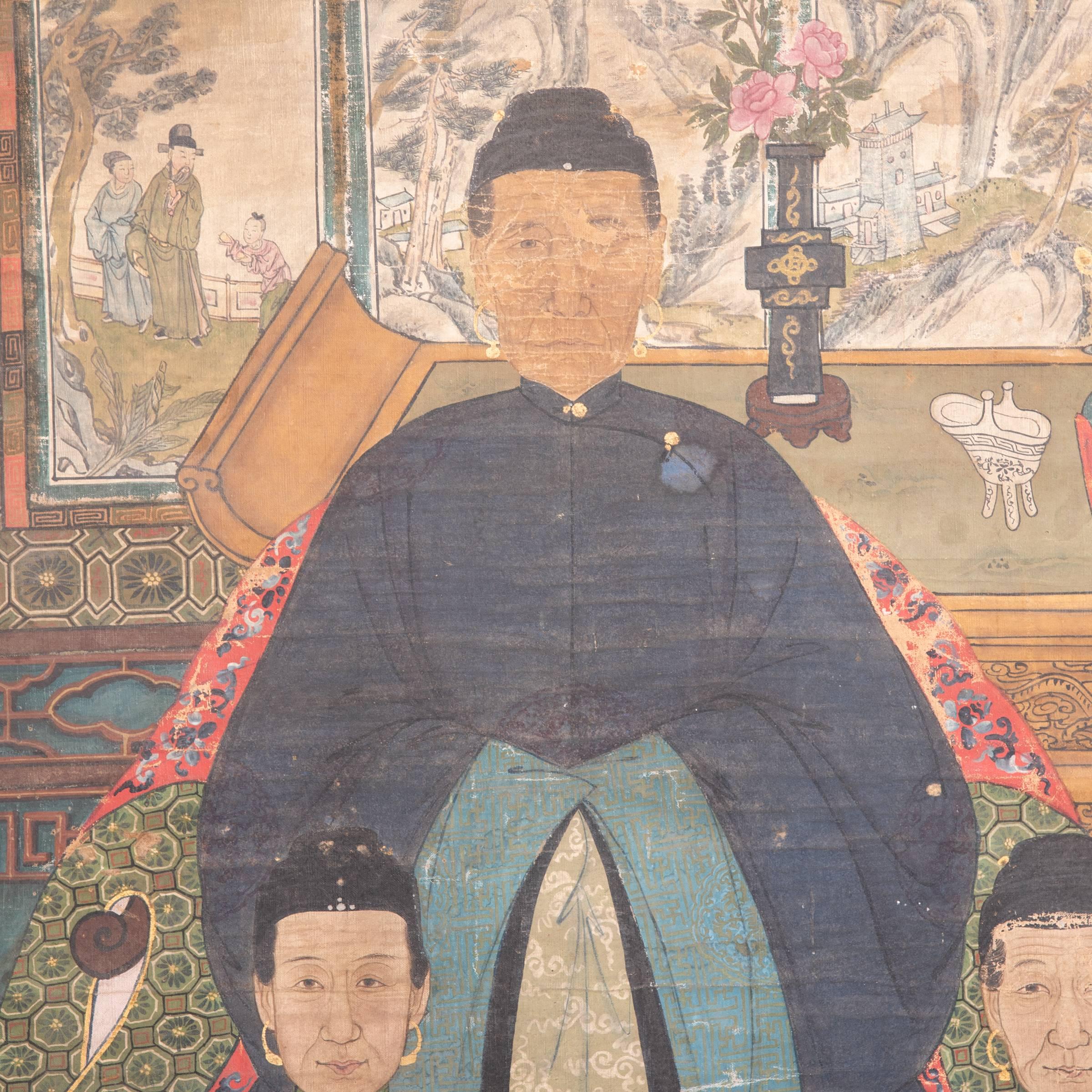 This richly colored and exquisitely detailed composition painted, circa 1850 during the Qing dynasty points to the central role ancestor worship played in Chinese culture. The painting depicts several generations, dressed in intricately detailed and