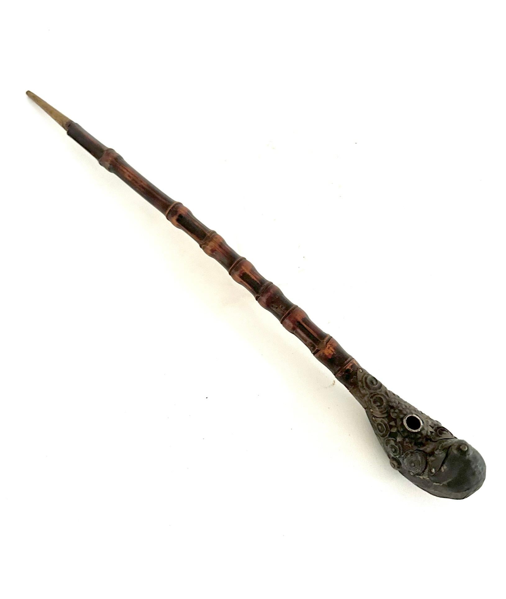 An opium pipe is a pipe designed specifically for the vaporization and inhalation of opium. But these beautiful little antiques have become one-of-a-kind works of art.
This late 19th century pipe is hand crafted from bamboo and brass, the pipe is