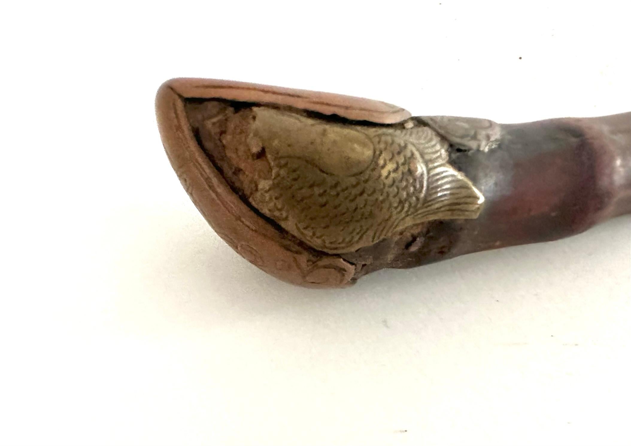 An opium pipe is a pipe designed specifically for the vaporization and inhalation of opium. But these beautiful little antiques have become one-of-a-kind works of art.
This late 19th century pipe is hand crafted from bamboo and brass. The pipe is