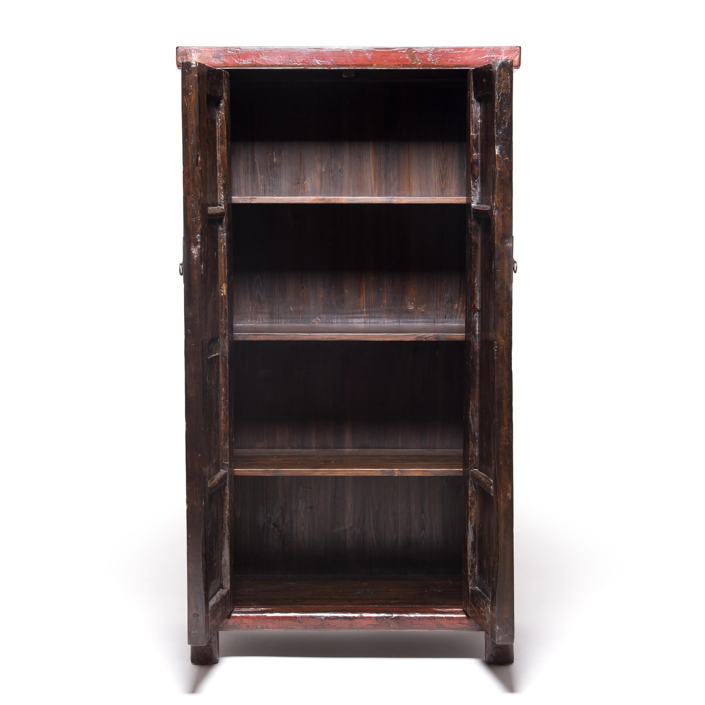 This richly lacquered cabinet from China's Shanxi province is over a century and a half old, with a finish that has acquired wonderful character and texture with age. Collectors appreciate cabinets configured like this—with doors that span full