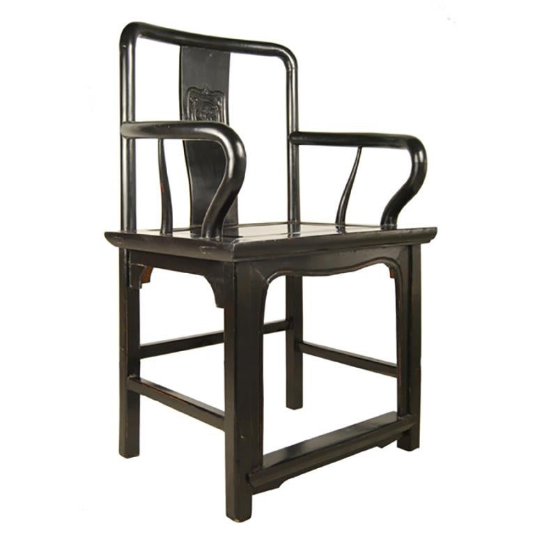 With its strong lines and upright stature, this imposing piece of furniture was the chair of choice for a 19th-century administrator in northern China. Made of northern elmwood, the chair has an elegant yet minimalist design, using curves to create