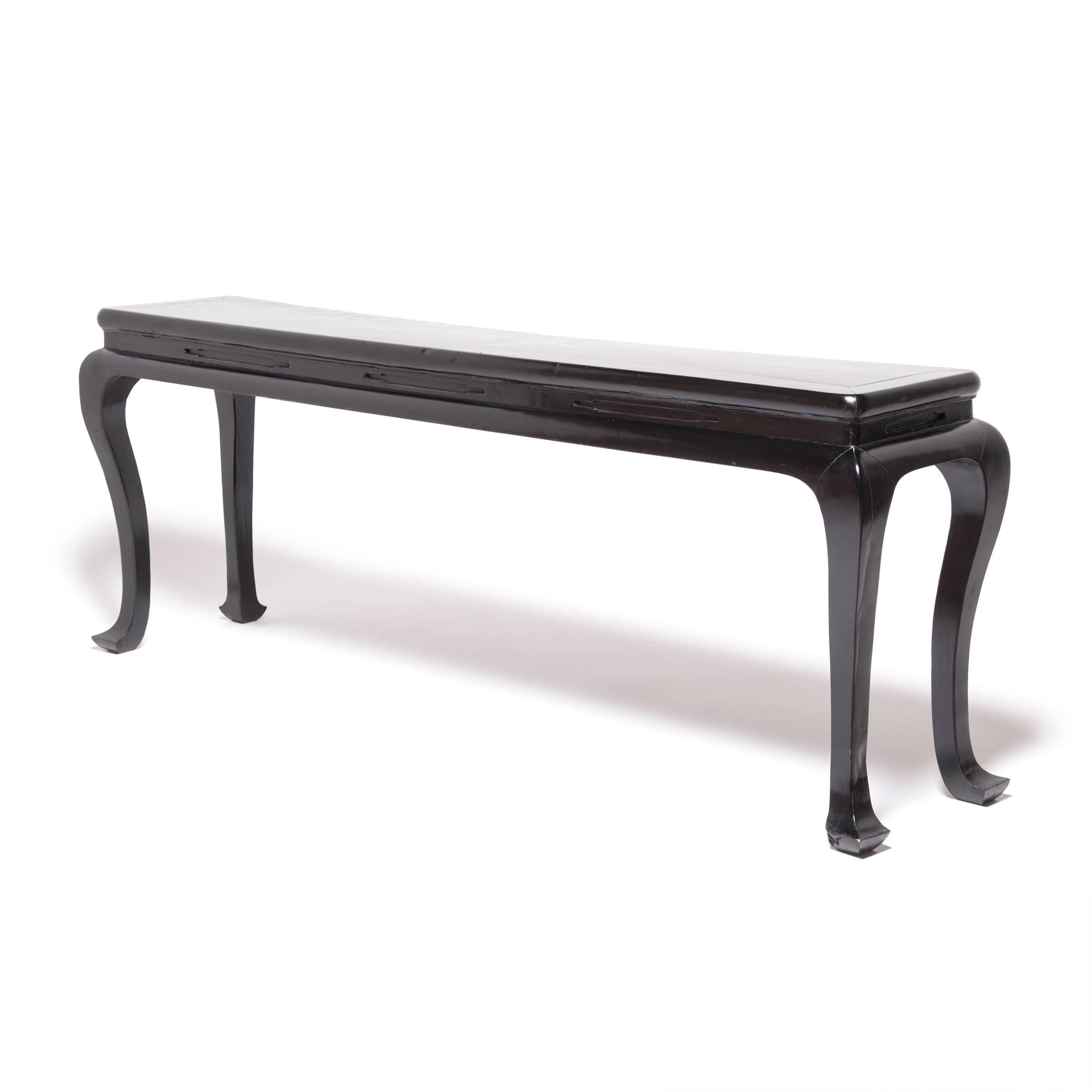 With deceptively simple design, this altar table demonstrates the power of a well-executed curve. Conforming to the minimal aesthetic of Ming-dynasty furniture, this 19th century table breaks away from strict linearity with legs that swell out from