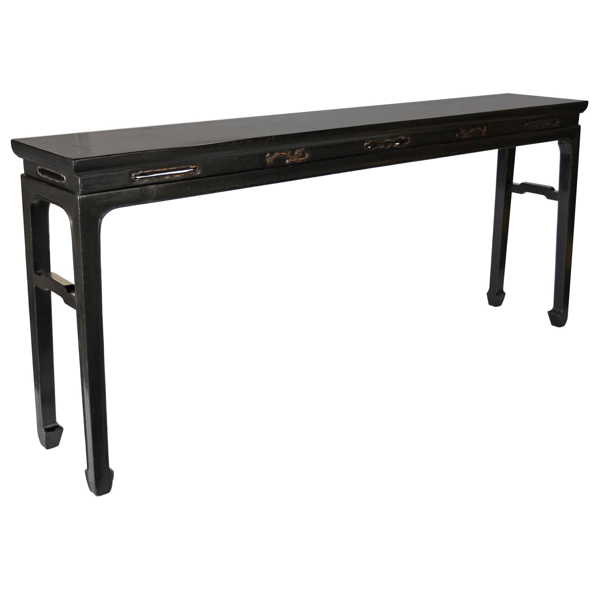 This refined plank top table is originally from a 19th century Chinese scholar’s rarefied home. There are not many surviving tables with such elegant proportions, the hoof feet and the legs relate beautifully to the top and aprons, which are carved
