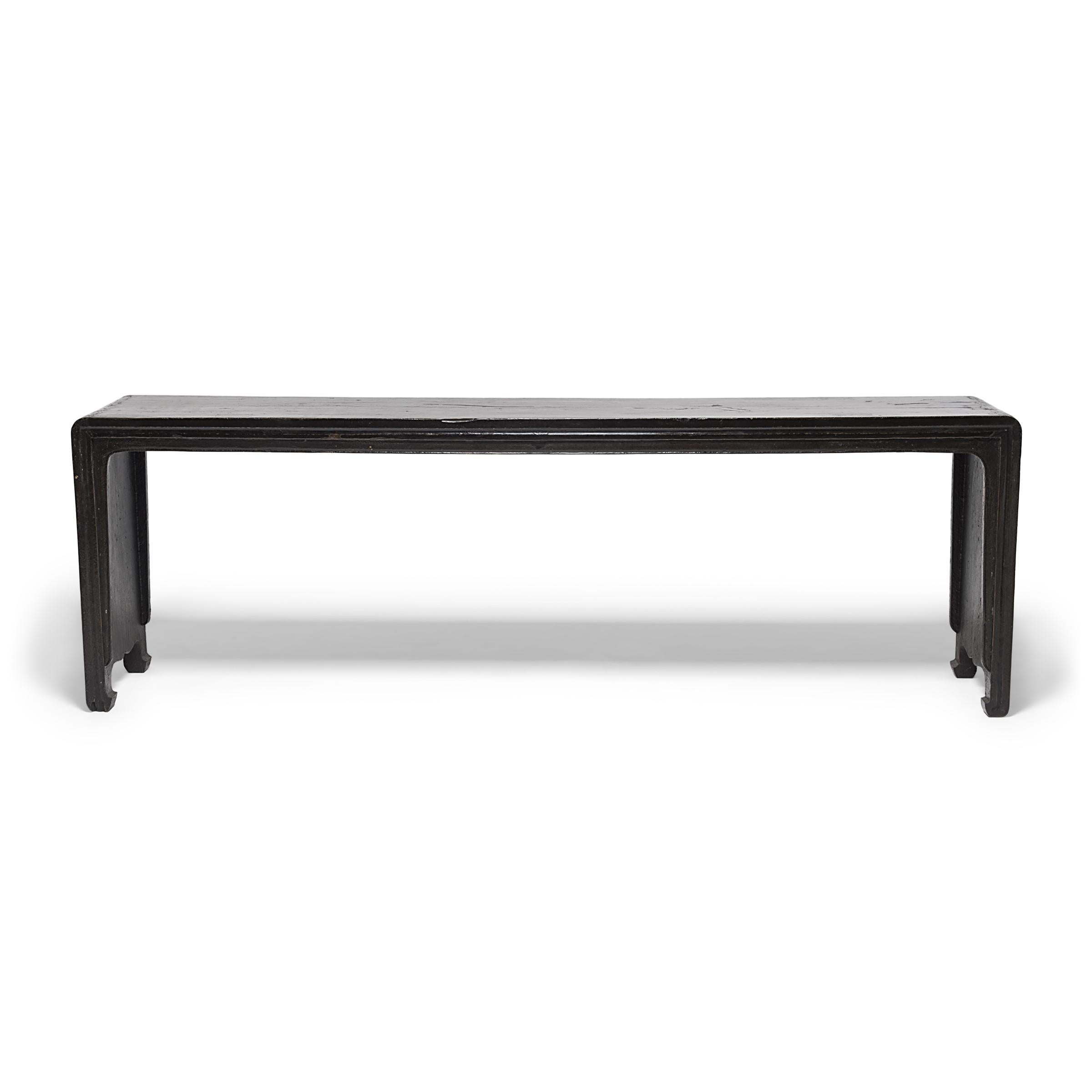 Bringing this altar table’s streamlined shape and waterfall flow into sharp Silhouette, the fantastic black lacquer, once glossy and seamless, has aged beautifully with depth and texture that imbue great character. Worn sections now give us a peek