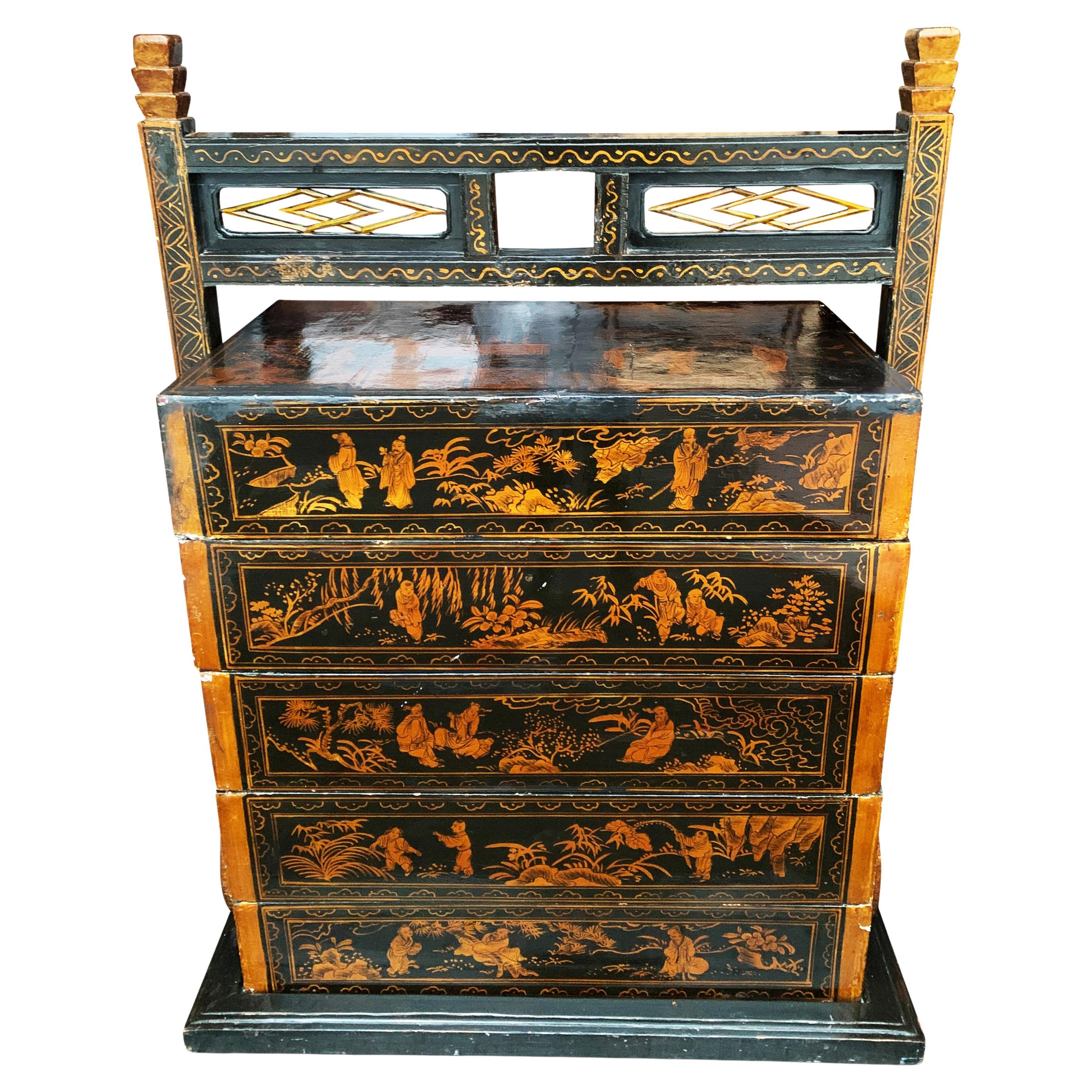 19th century Chinese black lacquered five section stacking chest with exquisite figural decorative scenes.




