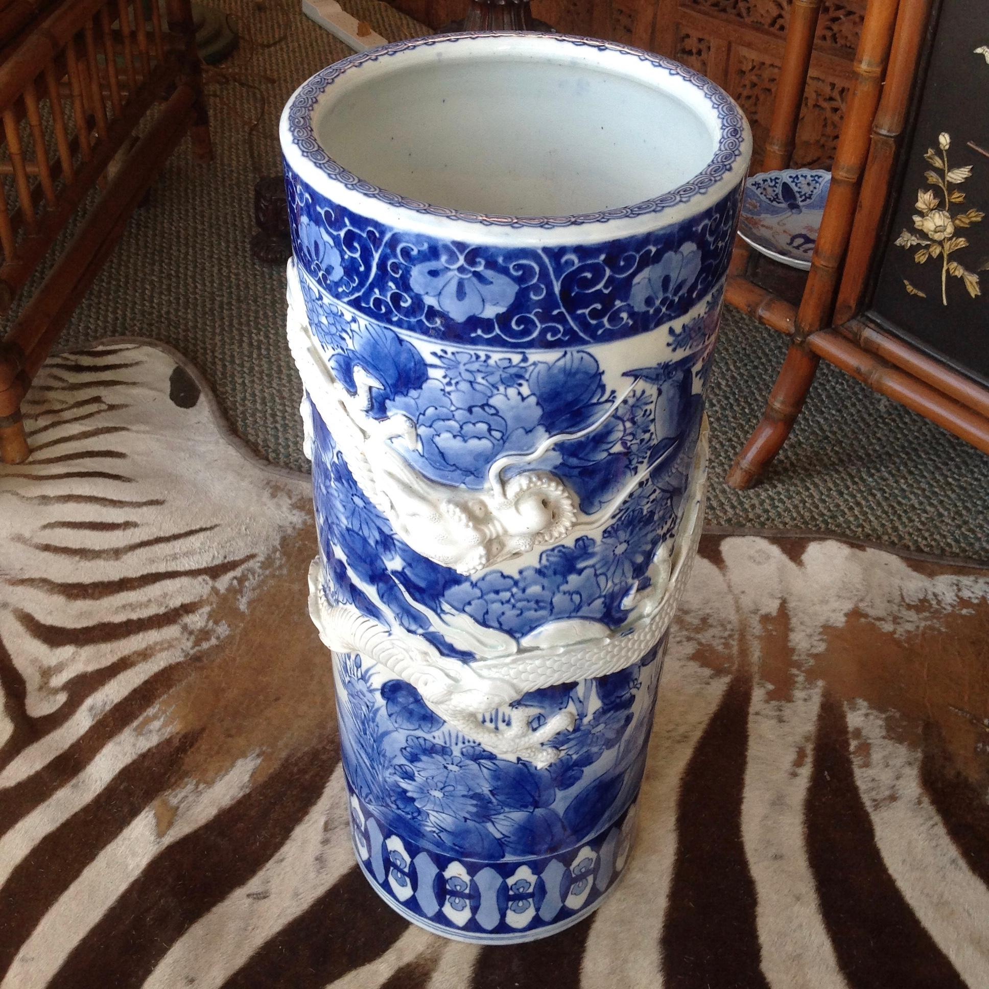 Dramatic dragon motif with the raised figure enveloping the stand.
Unusual and rare form.