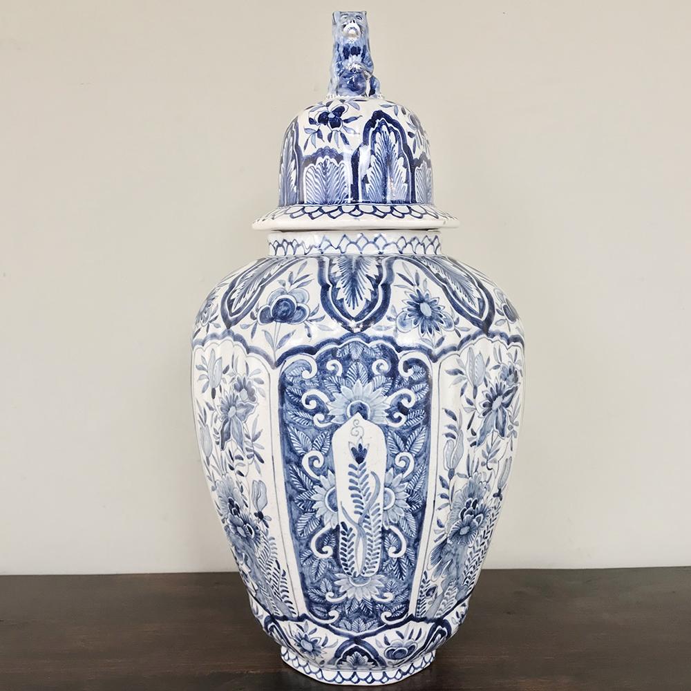 19th Century Delft Blue & White Lidded Vase features rich cobalt blues hand-painted across the entire facade including the lid with its foo dog tip!  The master potters of Delft were extremely skilled at producing such hand-fashioned works and