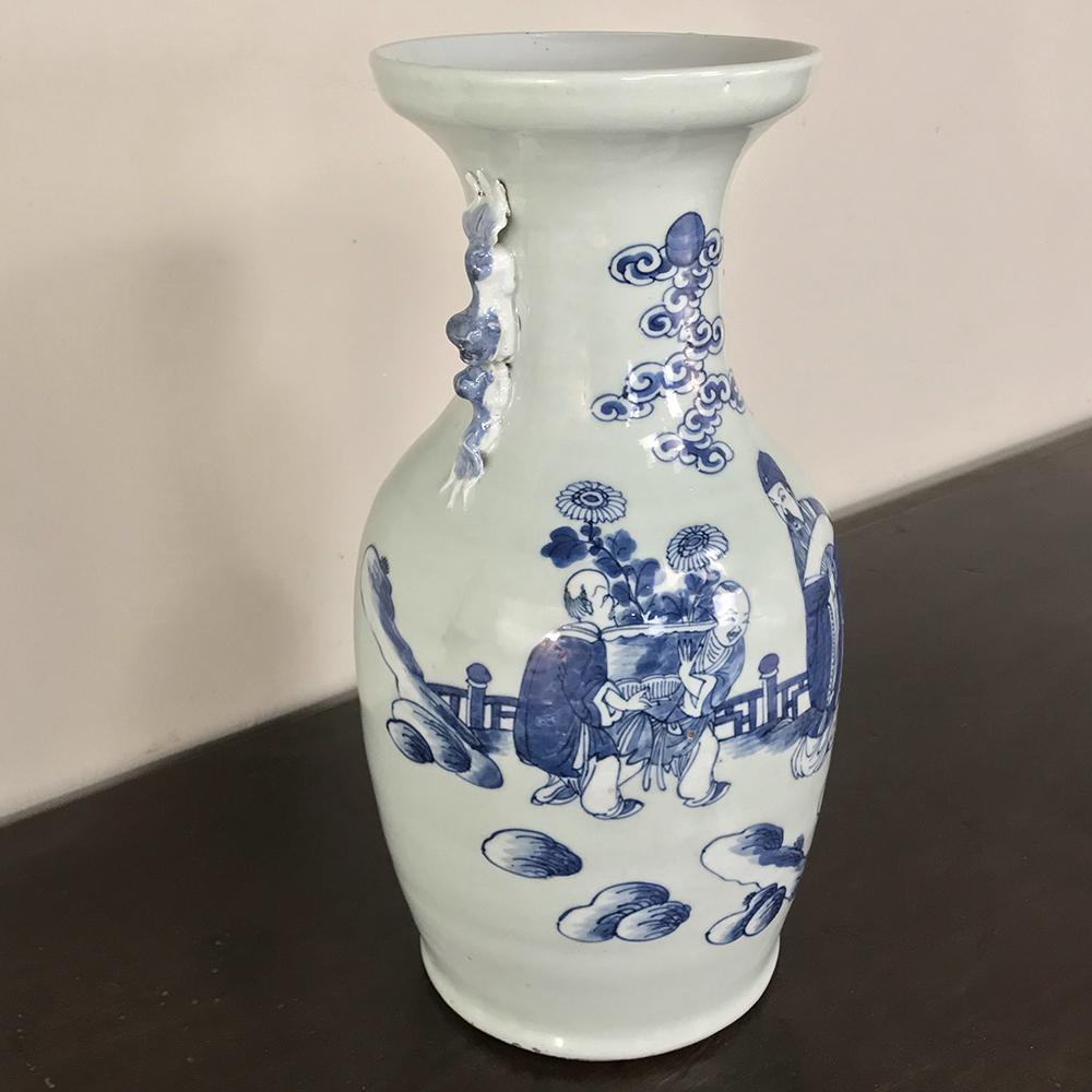 19th century Chinese blue and white vase features a timeless scene in the round, all executed in luscious cobalt blue on a classic shape formed from pure white Kaolin clay. Such examples were produced in China for the lucrative European and Middle