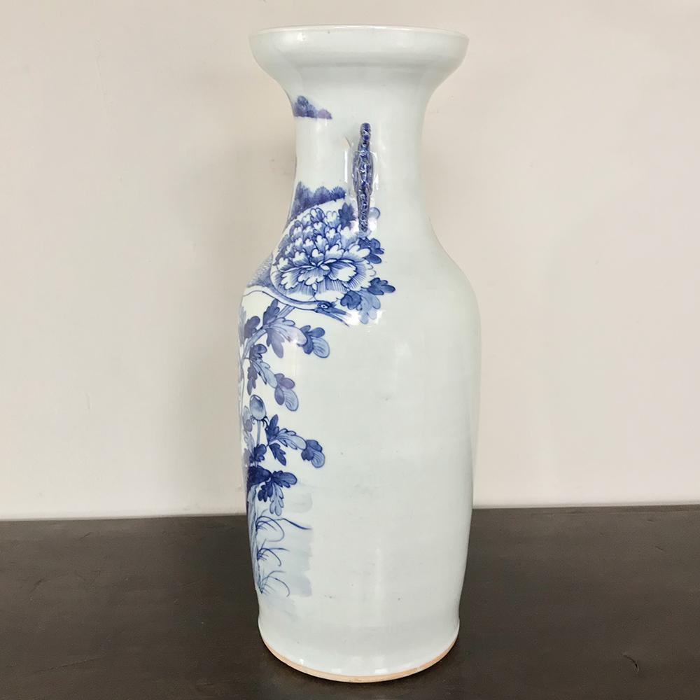 19th century Chinese blue and white vase features a timeless scene in the round, all executed in luscious cobalt blue on a Classic shape formed from pure white Kaolin clay. Such examples were produced in China for the lucrative European and Middle