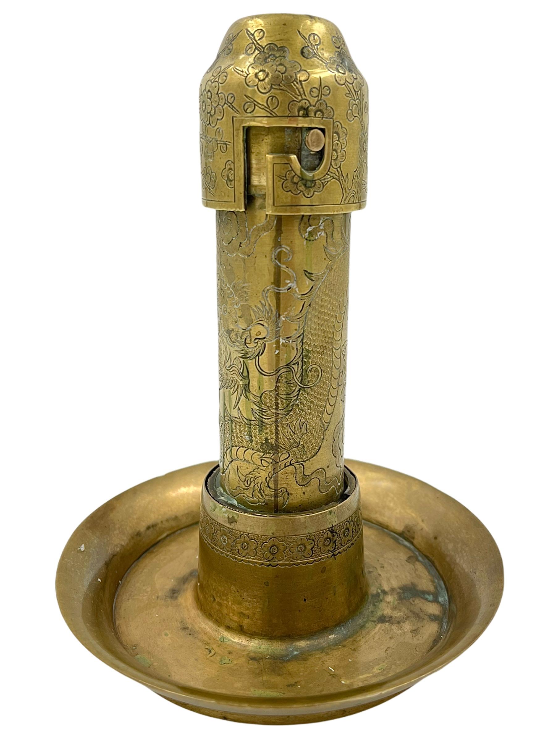 Patinated 19th Century Chinese Brass Dragon Motif Candle Holder For Sale