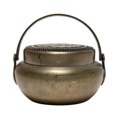 Calientamanos chino de latón con fénix, c. 1850