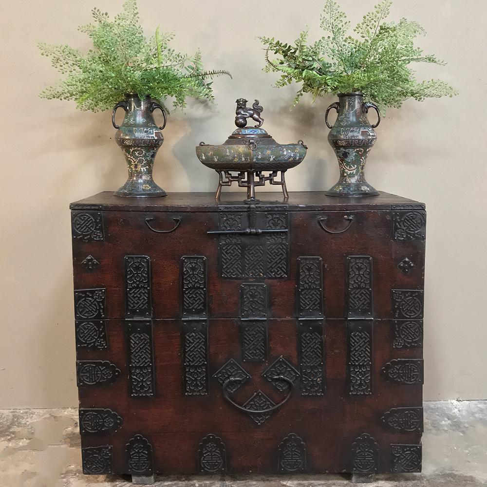 19th century Chinese cabinet ~ Trunk
This Chinese lacquered trunk is a wonderful example of the Oriental arts, with heavily embellished hand-hammered iron hardware all across the facade, including the pulls and hinges, set upon a rustic background