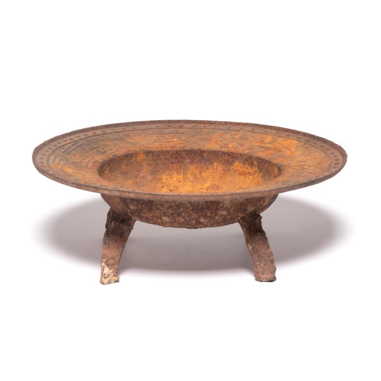 Time has a way of cloaking functional objects in mystery. At least that’s how we feel about this fantastic brazier acquired from a discerning collector who lived in China for decades. Imbued with rusted character, the once finely detailed tripod