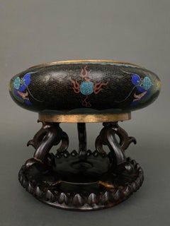 19th century Chinese cloisonné cup with dragon decoration on wooden stand.