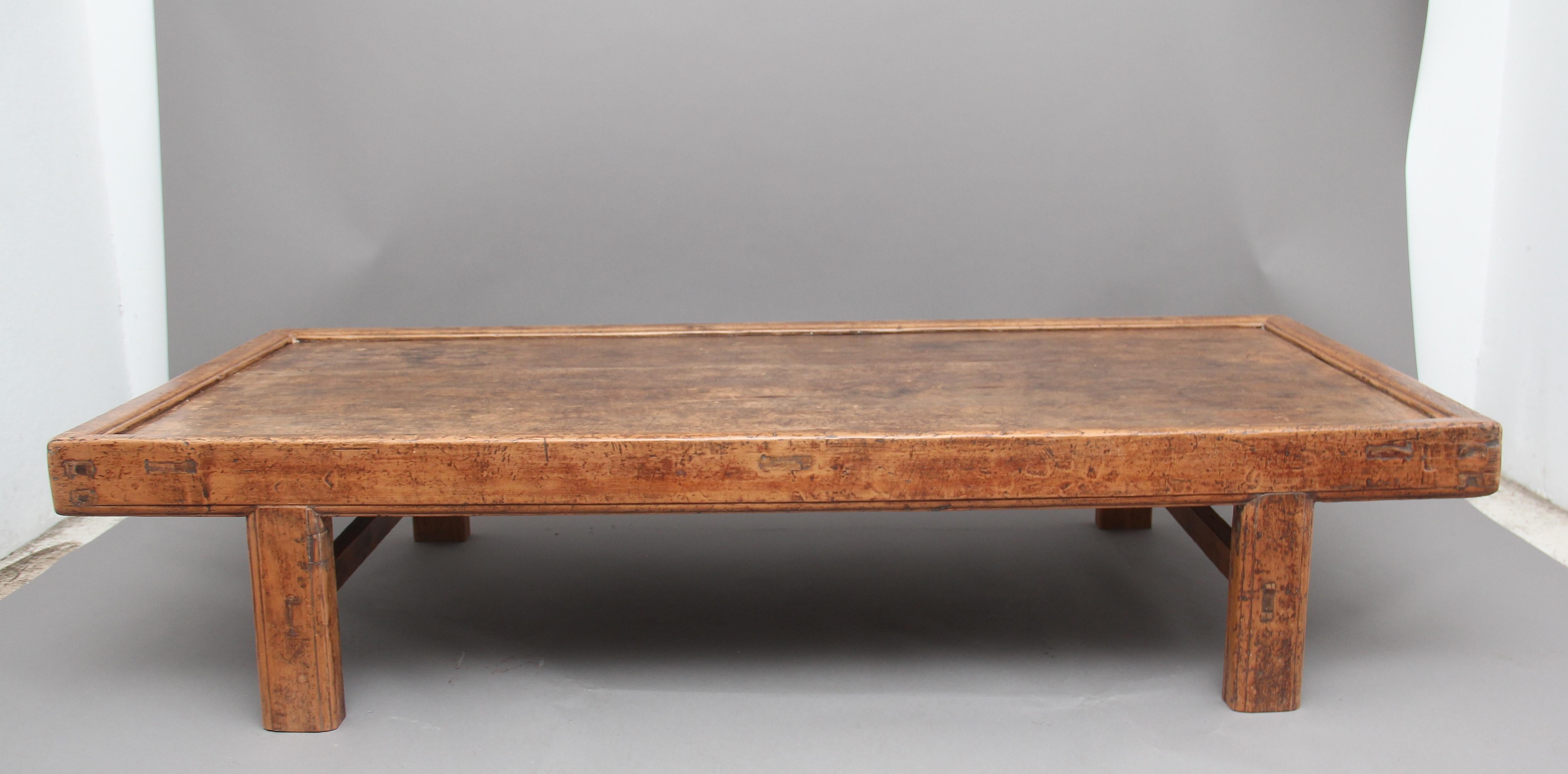 19th century Chinese bed / coffee table in a rustic style, the recessed top with a molded edge supported on chunky square legs united with side stretchers, the table has a lovely color, in great condition and ideal for use as a large coffee table,