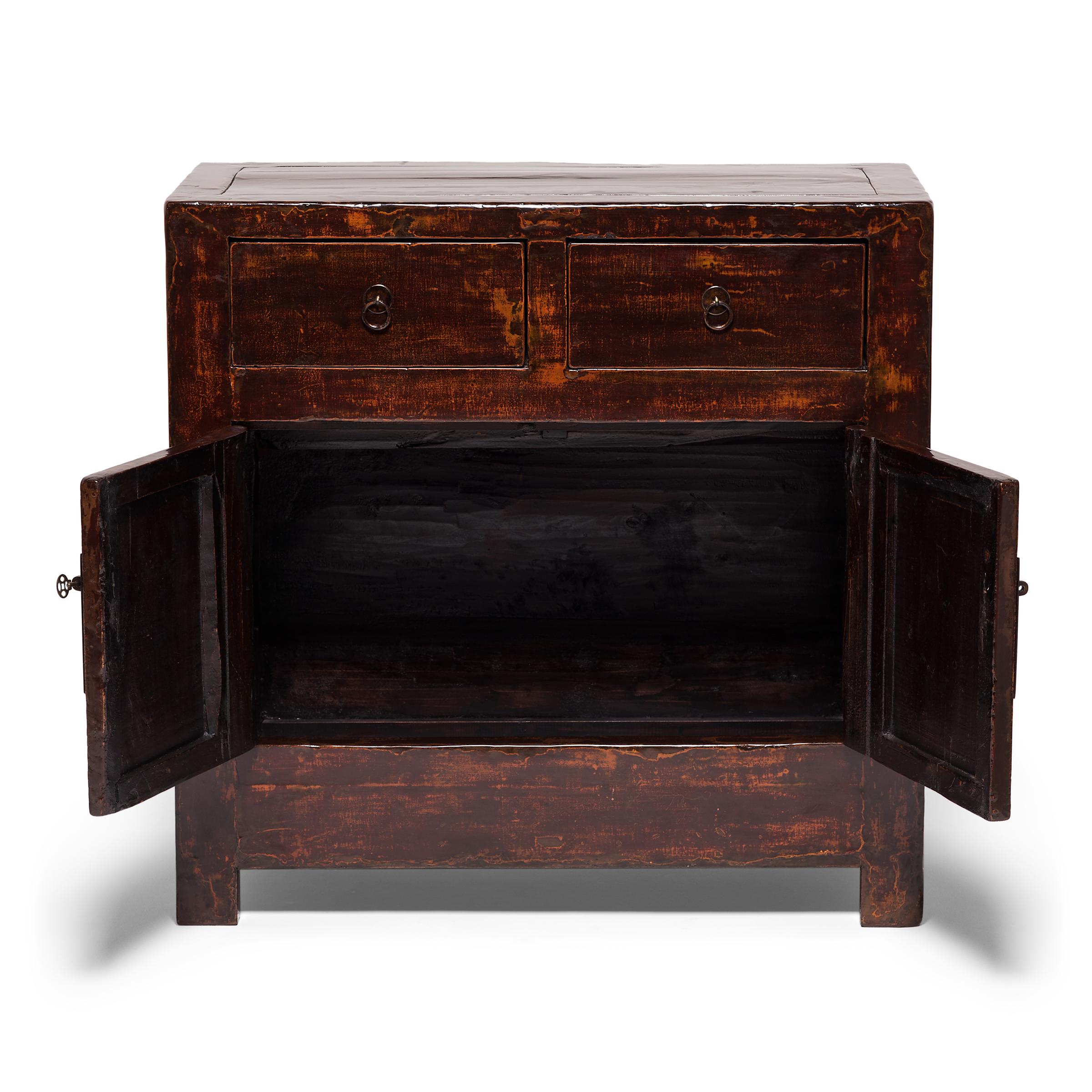 Over century and a half ago, an craftsperson from China’s Anhui province constructed this chest of the finest elmwood. At first glance it has a beautiful simplicity, but subtle details make this chest particularly striking. The brass hardware is