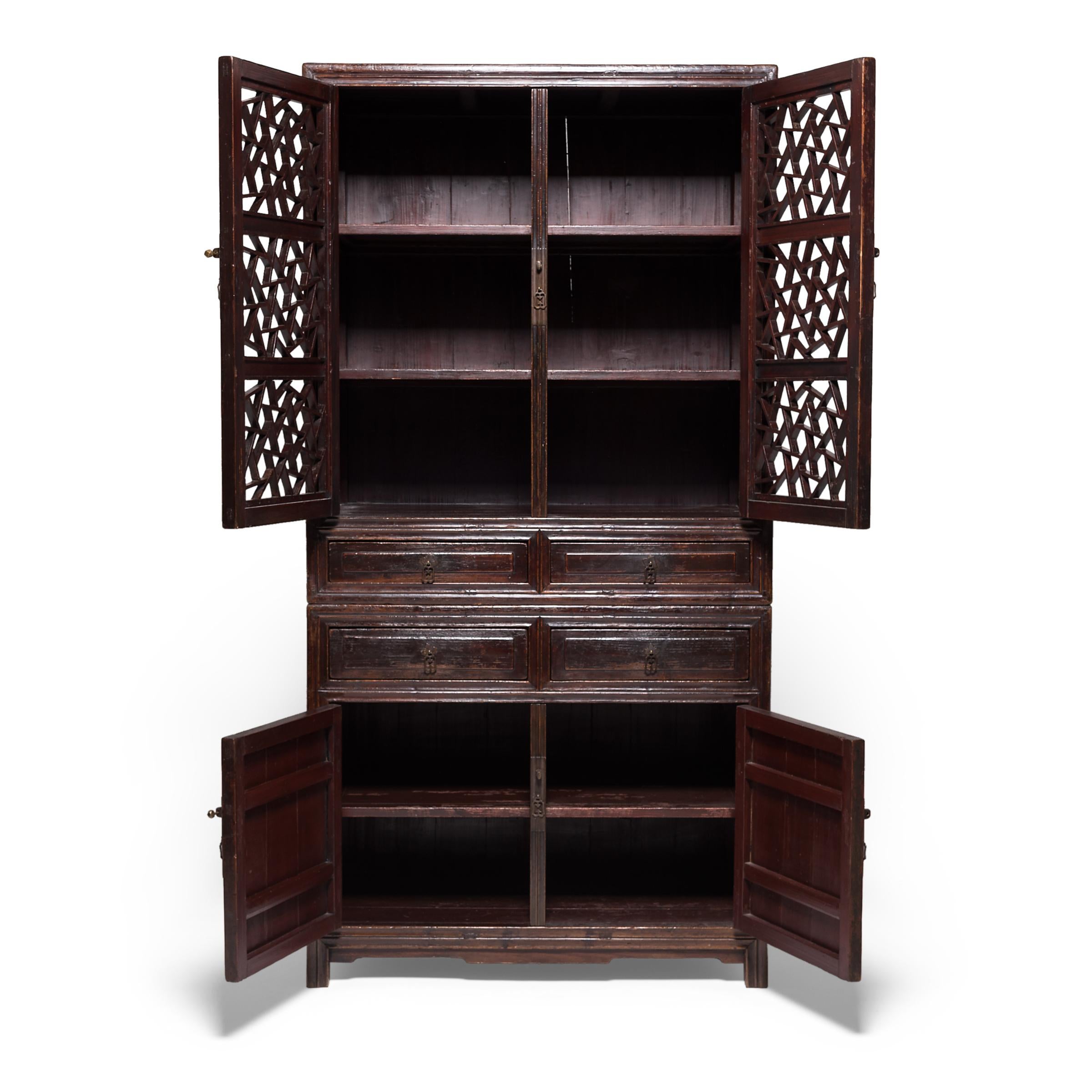 This elegant 19th century tall cabinet was crafted by an artisan in Suzhou, China's 