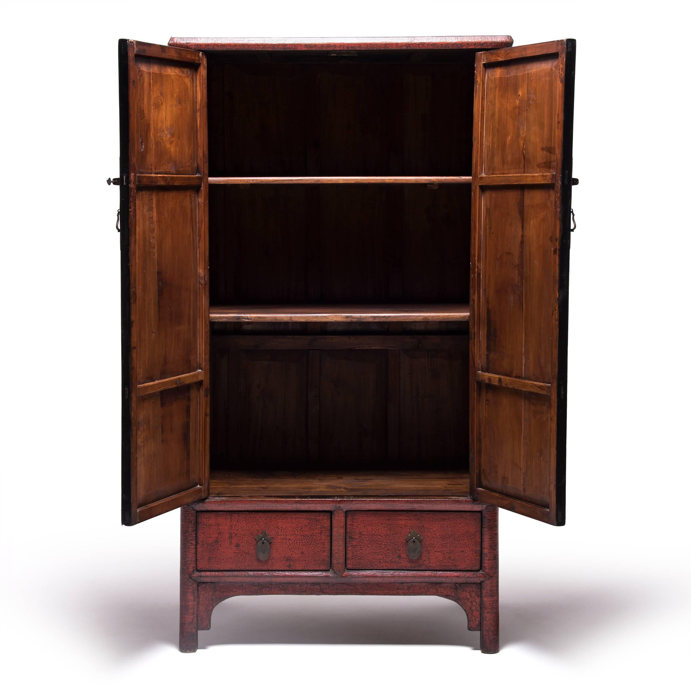 A classic piece of Chinese furniture, this 19th century lacquered cabinet possibly once occupied a home in China’s Shanxi Province, its shelves filled with curios or embroidered silks. It stands proudly with a top board reaching slightly beyond the