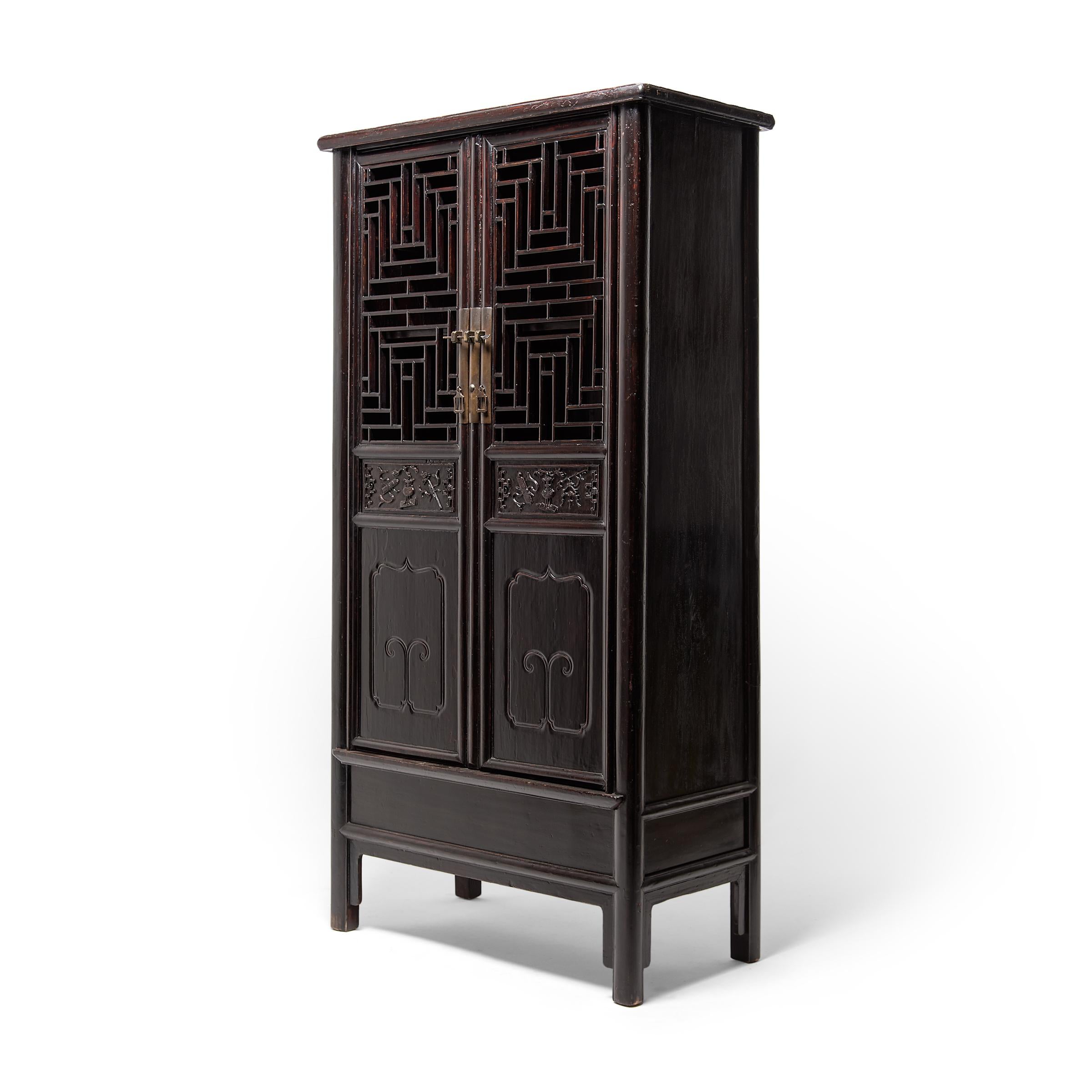 The focal point of this beautiful 19th century scholars' display cabinet is undoubtedly the complex diamond-form lattice panels fitted into the tall double doors. Unlike fretwork made by carving or perforating a solid panel, this lattice would have