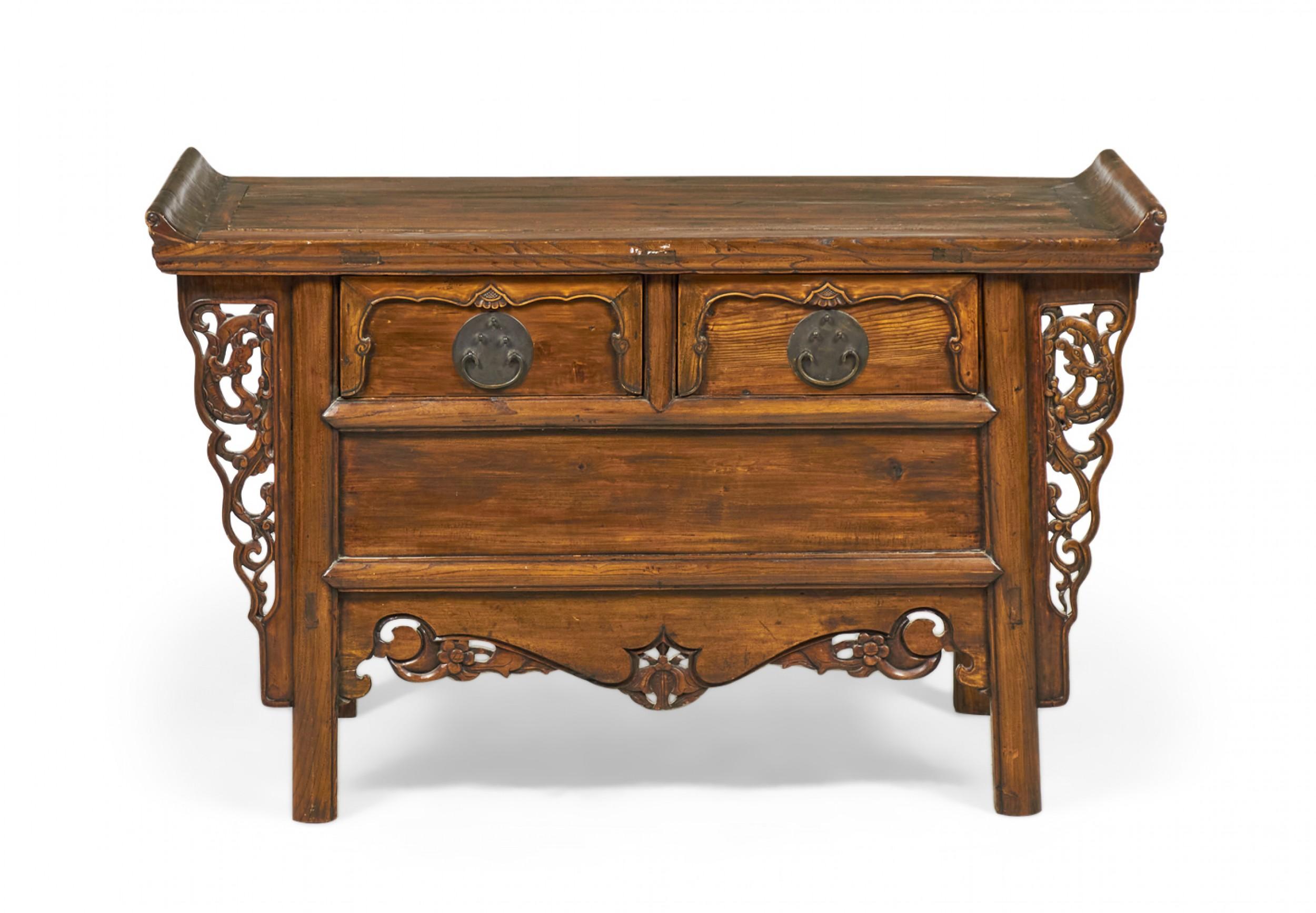 Antique Chinese (19th century) elm altar table with a rectangular top with two shallow side galleries above two carved front drawers with bronze drawer pulls, flanked on either side and below by elaborately carved reticulated side panels, all
