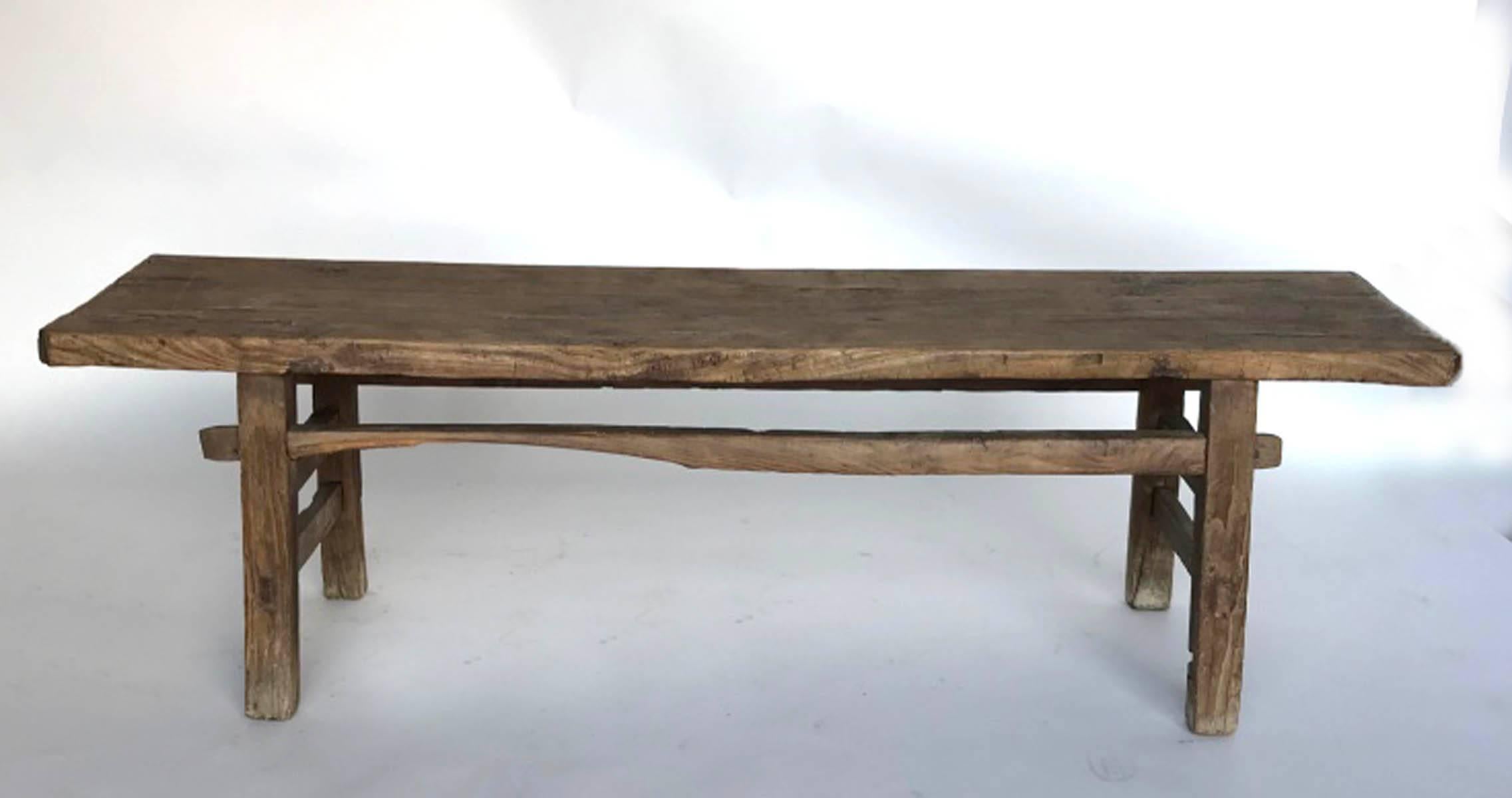 Rustic 19th century elm bench, beautiful wood grain with smooth to the touch patina. Mortise and tenon construction. Double side stretchers.
 