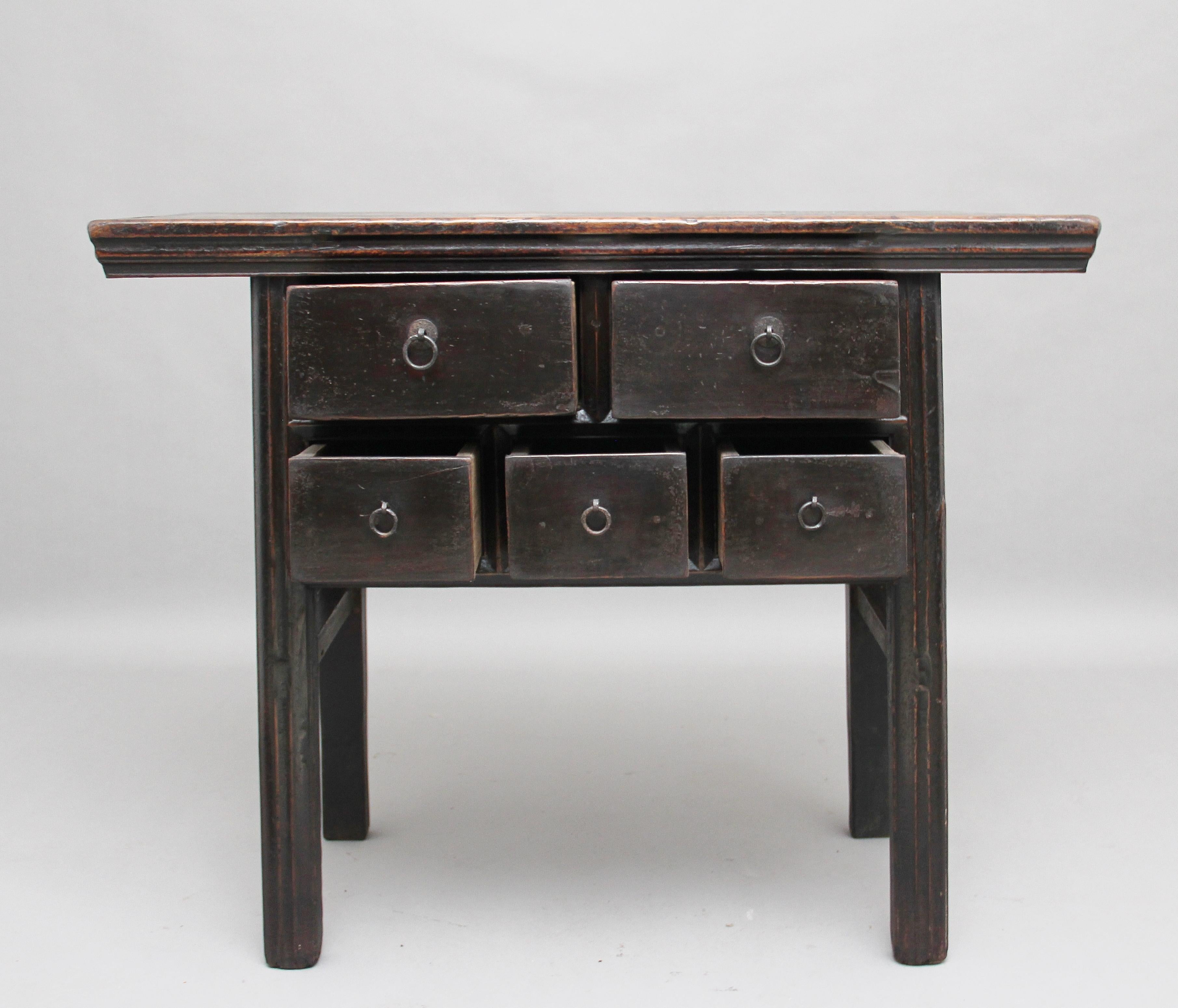 19th century Chinese elm dresser, the moulded rectangular top above a selection of two long over three short drawers with original brass ring handles, supported on square legs united by side stretchers, circa 1880.