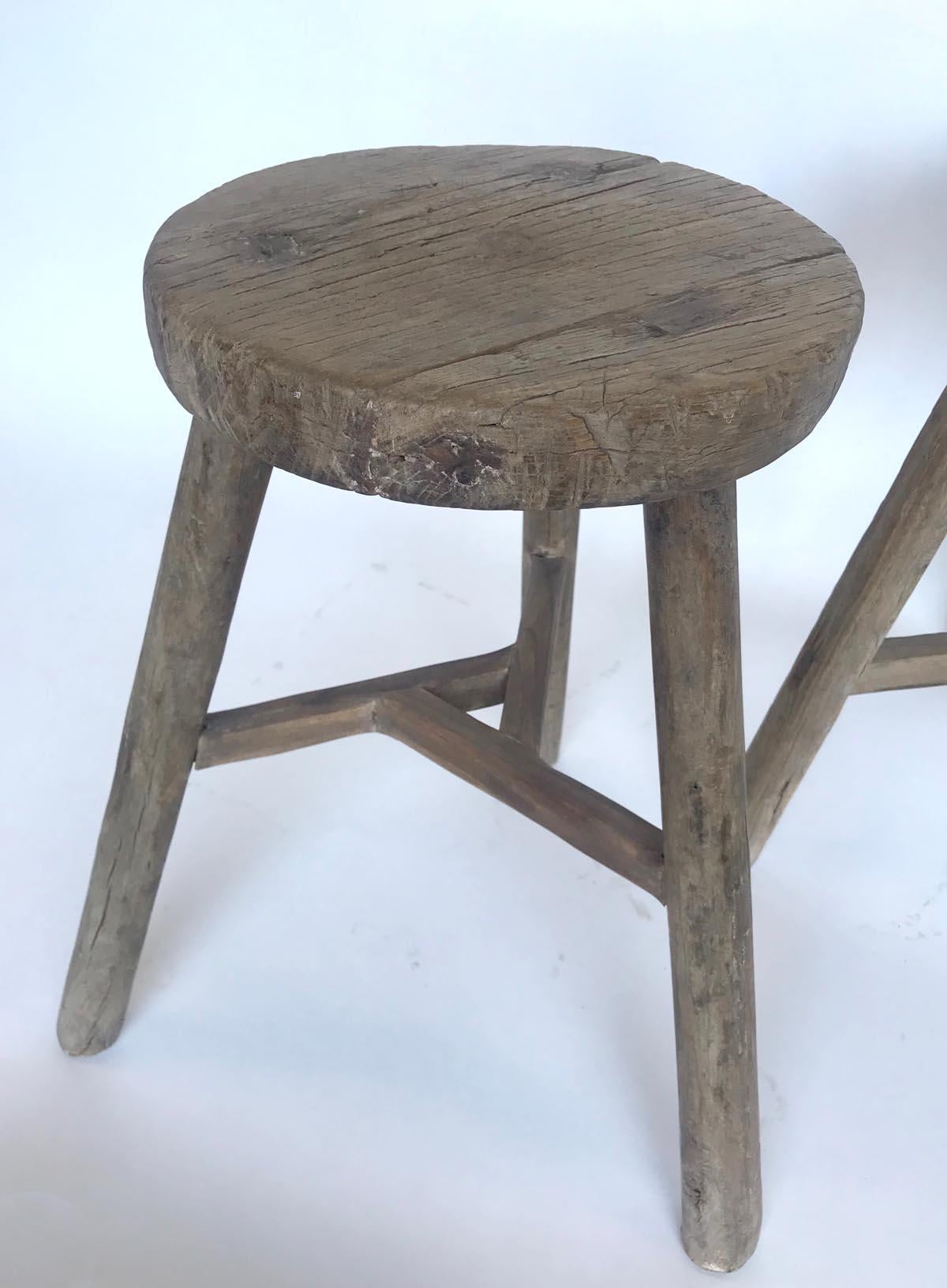 19th c. Chinese elm stools with various base configurations. Smooth, weathered, worn grey patina. Mortise and tenon joinery. Great for extra seating, a small side table or as a plant stand.
Sold separately, $785 each. Please refer to left, middle