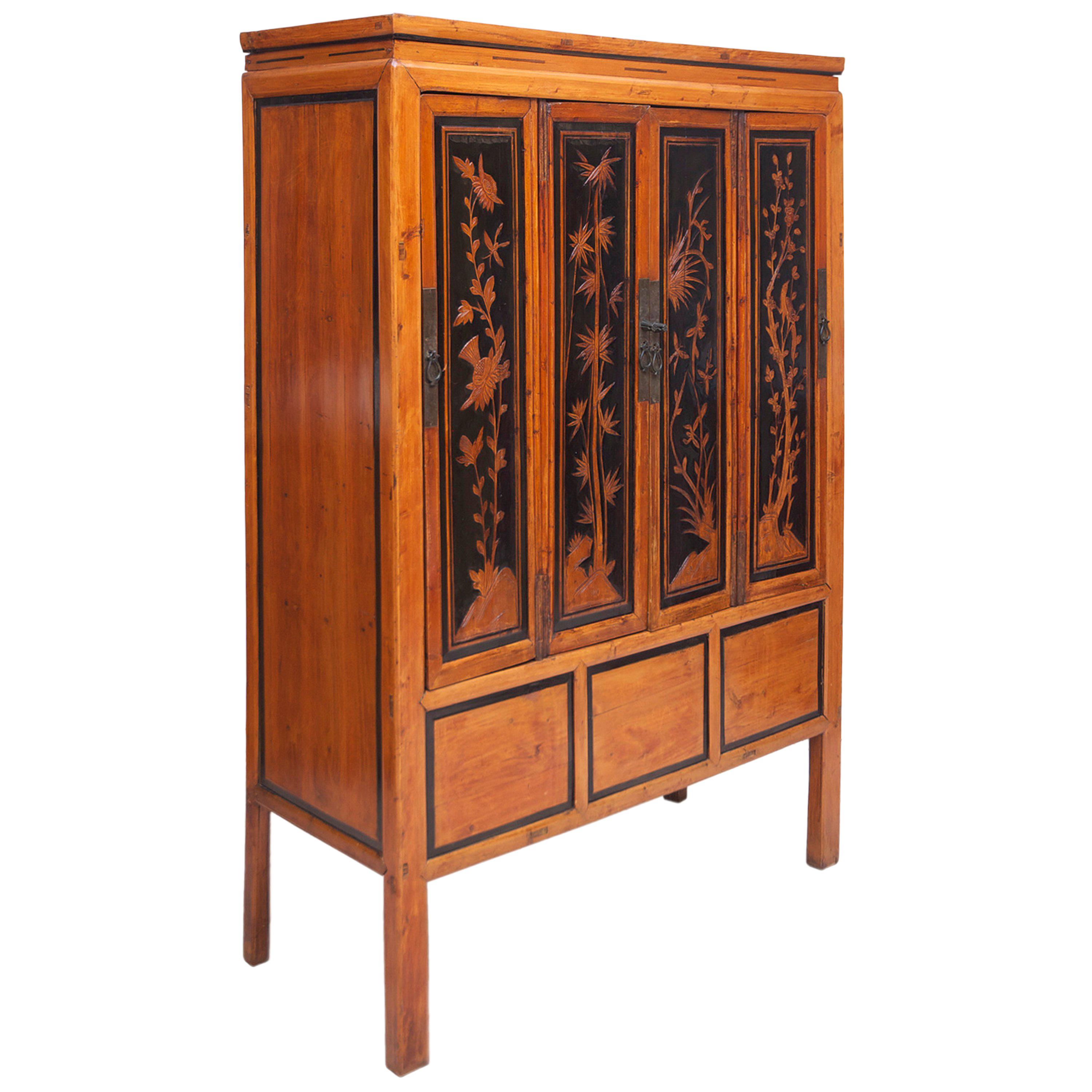 Antique Chinese Cabinet in Elm with Carved Scenes of Four Seasons & Ebonizing For Sale