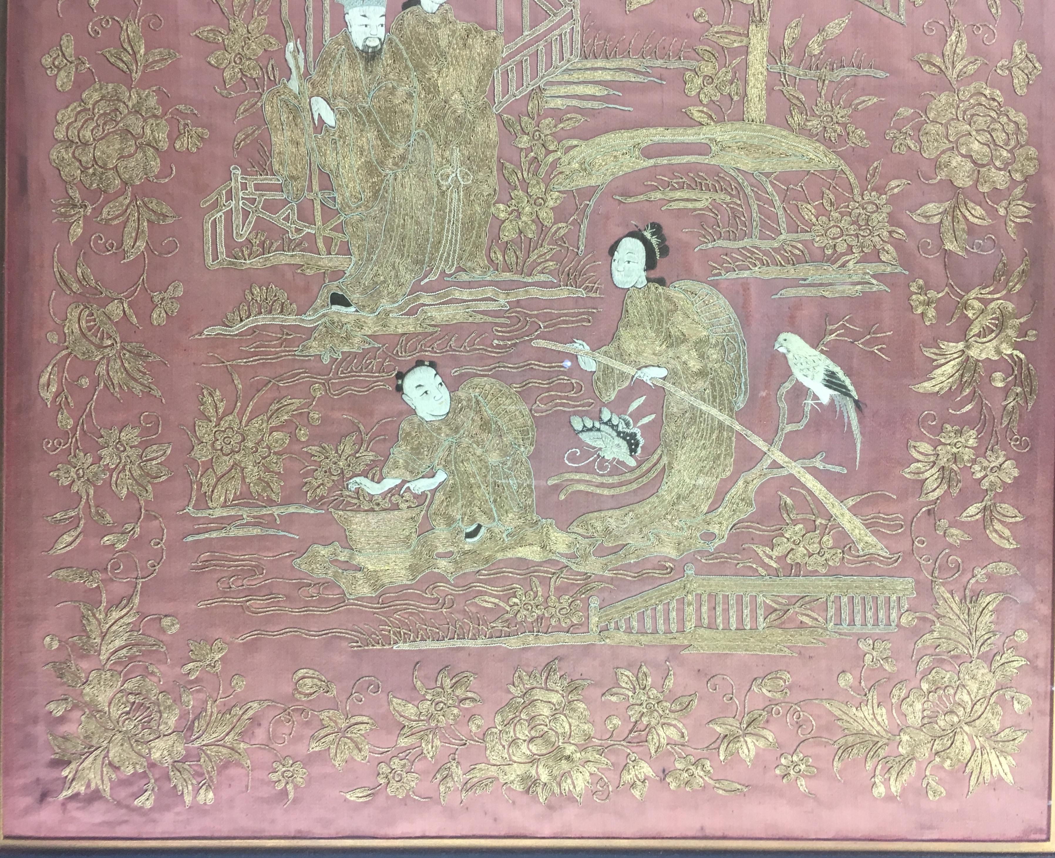 Hand embroidered framed wall tapestry with striking red silk fabric and contrasting golden thread. Depicting everyday life celebrations with multiple figures, iconic Chinese style architecture and birds. Professionally framed under glass with