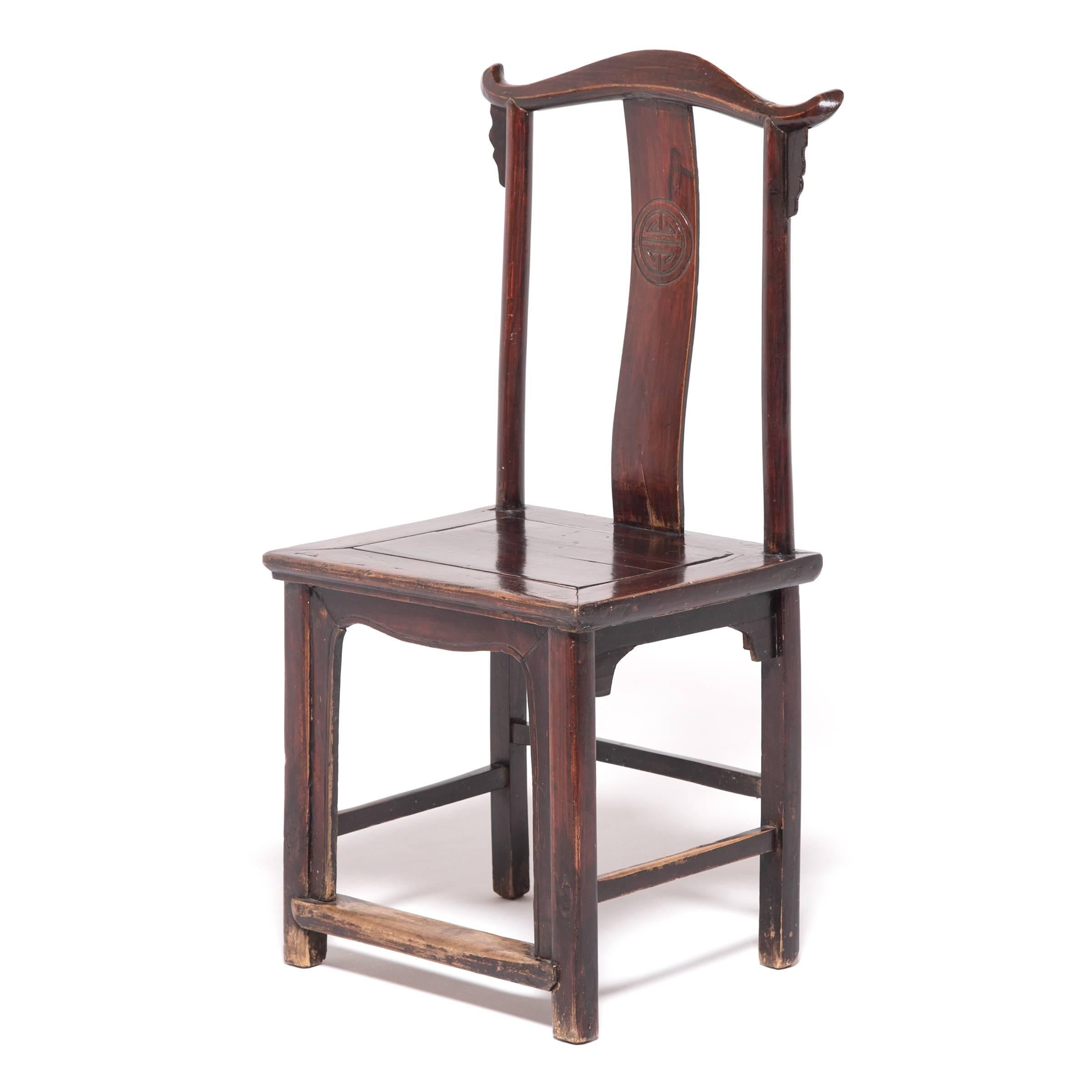 Rooted in ancient imperial courts and reinvigorated during the Ming dynasty, the emperor chair is also known as an “official’s hat chair” for the shape of the sculpted crest rail that resembles a winged hat. Crafted with dynamic lines and subtle