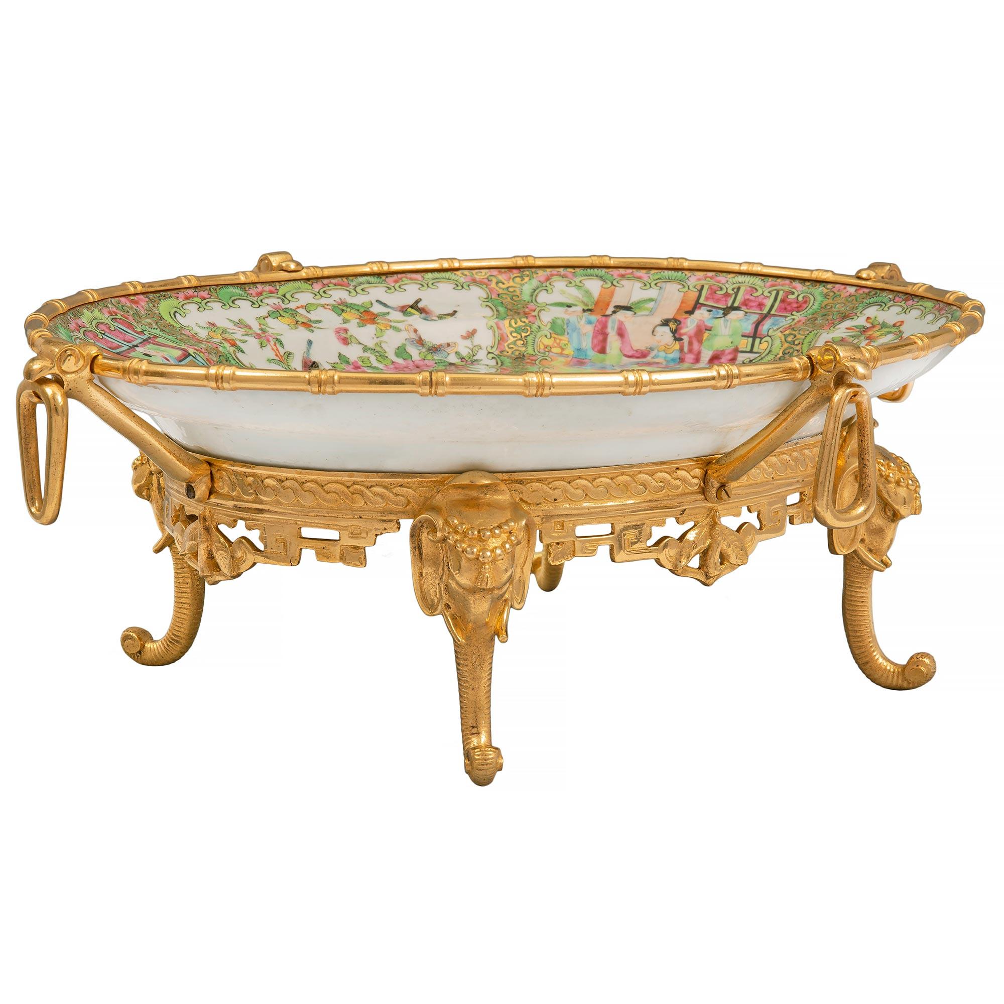 A most elegant 19th Century Chinese export Famille rose porcelain bowl, fitted with French 19th century Louis XVI st. ormolu mounts. The centerpiece bowl is raised by a striking ormolu base with superb and most decorative elephant trunk feet. The