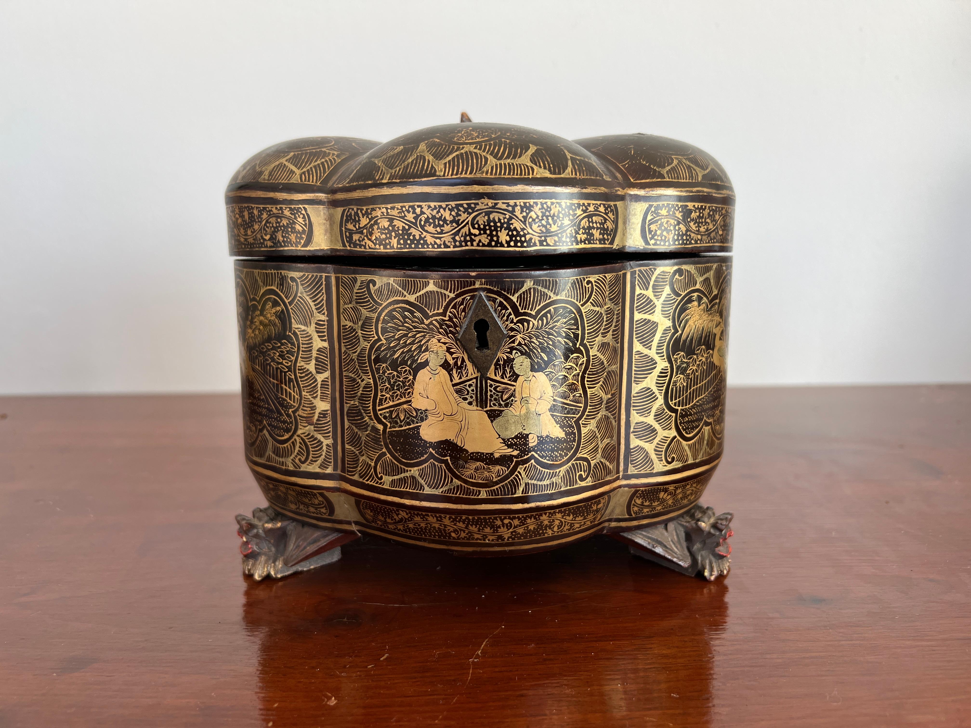 Chinese, 19th century.

Chinese lacquer and gilt decorated melon form tea caddy chest or box. The piece is heavily decorated with chinoiserie windows and supported by three giltwood carved dragon feet. Unfortunately missing the original pewter tea