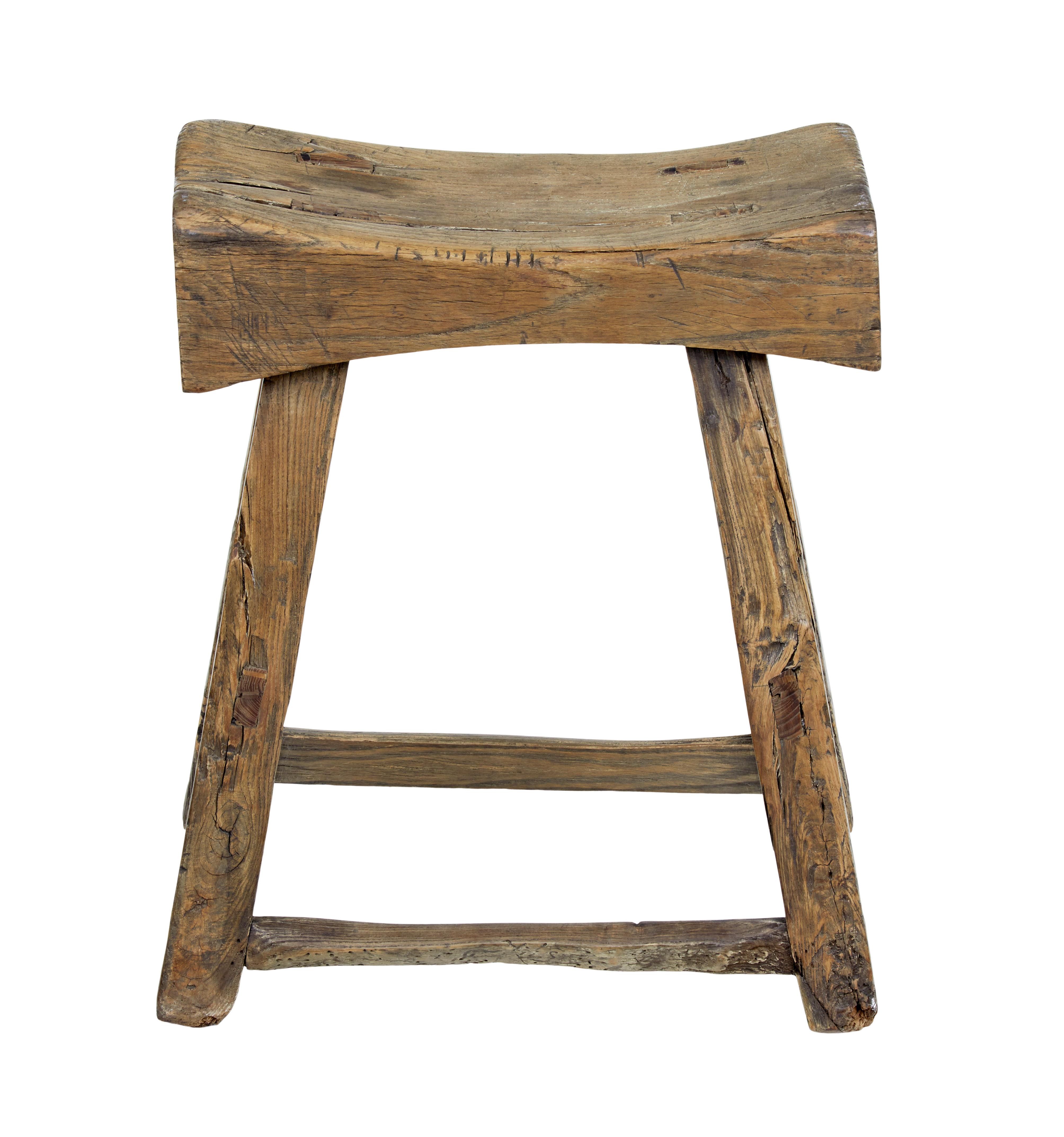 Good quality Chinese hardwood joint stool, circa 1870

Carved out seat almost like a butchers block. Standing on 4 legs joined by stretchers.

Character pieces of wood with knots and splits and old restorations. Heavy item due to the dense wood