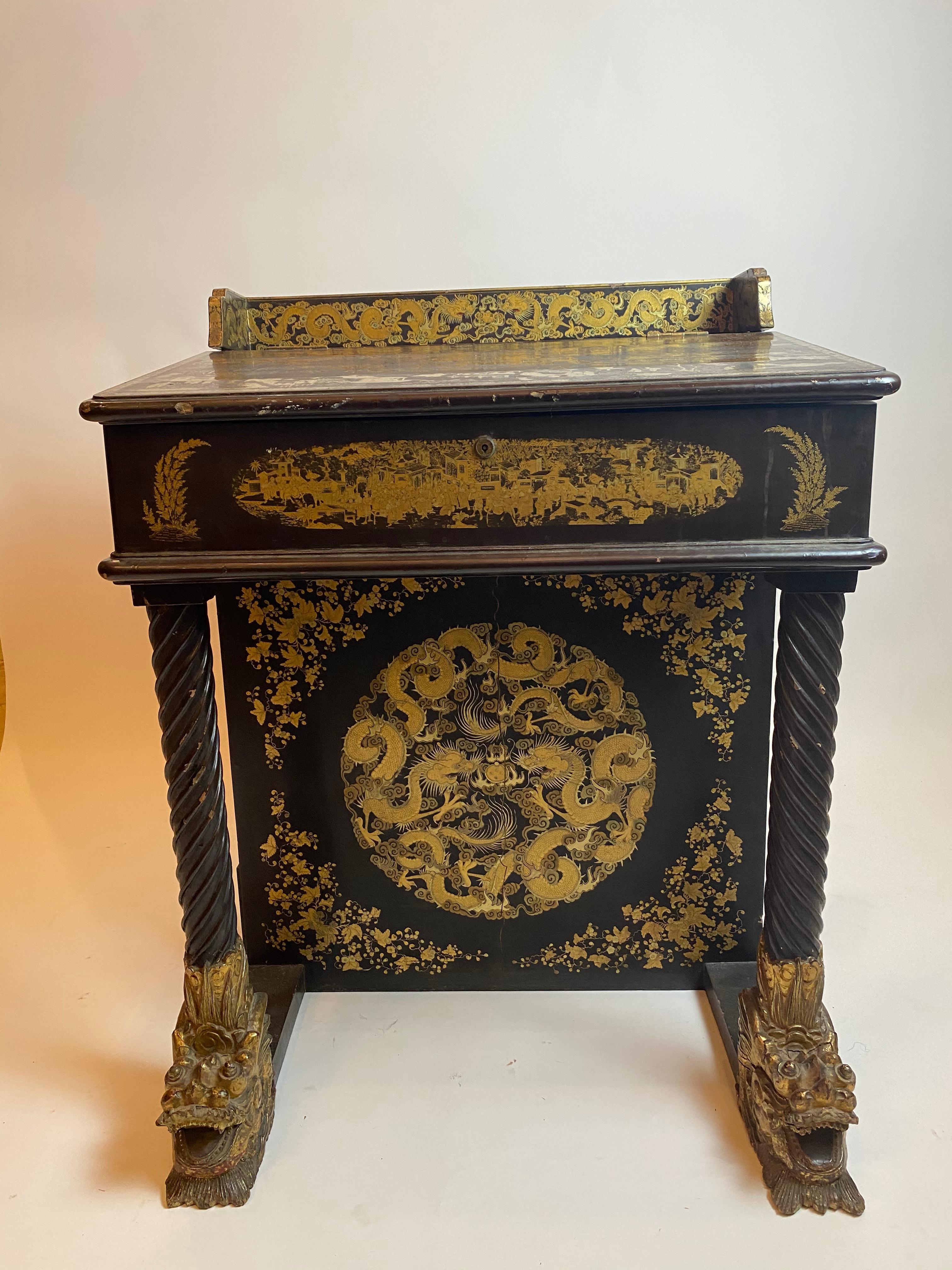 Early 19th century Chinese export lacquer and gilt Davenport desk, the entire finely decorated with the typical figural landscape and foliate gilt decoration, the sloped top opening to reveal a fitted interior with stationary divisions, above
