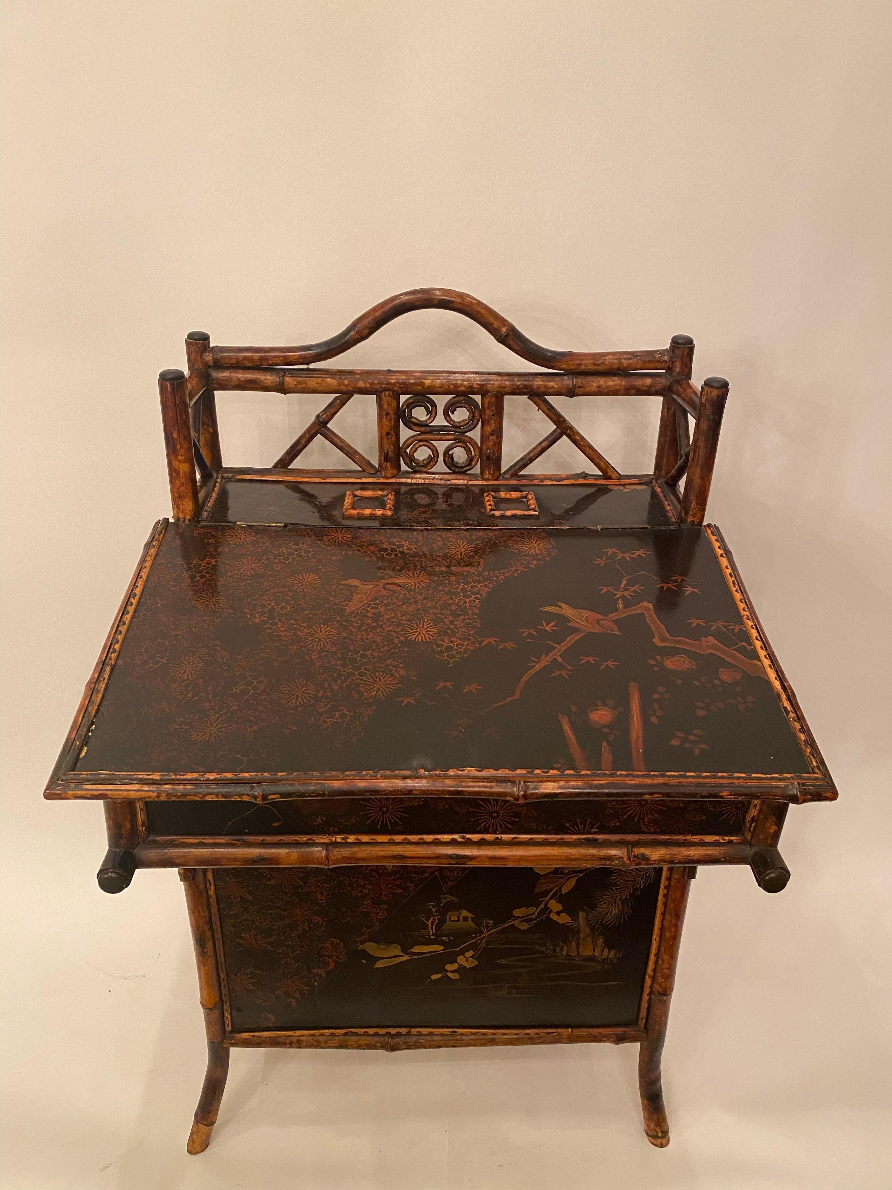 Late Meiji Period, circa 1900-1915, Japanese export lacquer and gilt Davenport desk, the entire finely decorated with the typical figural landscape and foliate gilt decoration, the sloped top opening to reveal a fitted interior with stationary