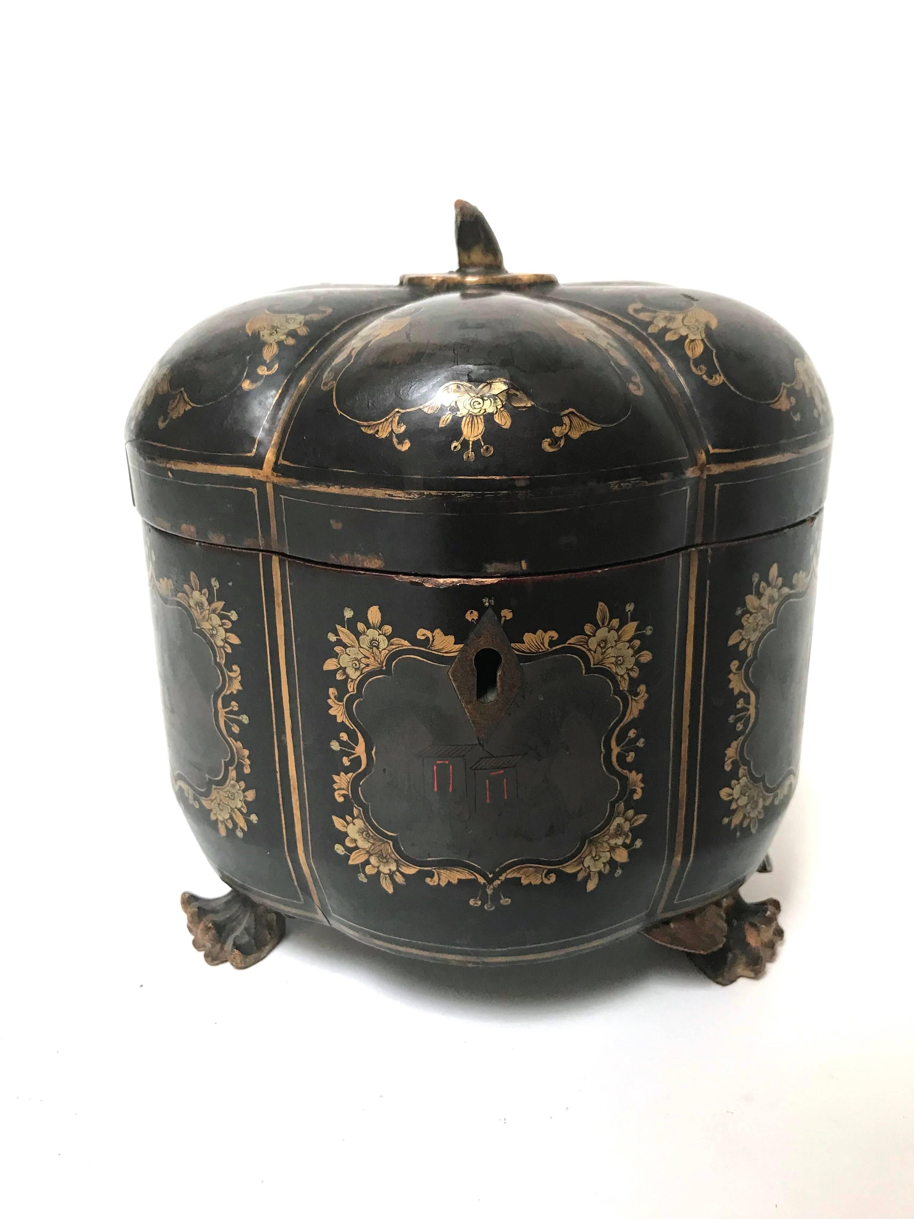 A rare melon form Chinese export lacquerware tea caddy and liner, circa 1830s, comprising six radially lobed segments, the face of each decorated with a (faded) scenic panel cartouche framed in gilt florals, the gilding repeated on the cover topped