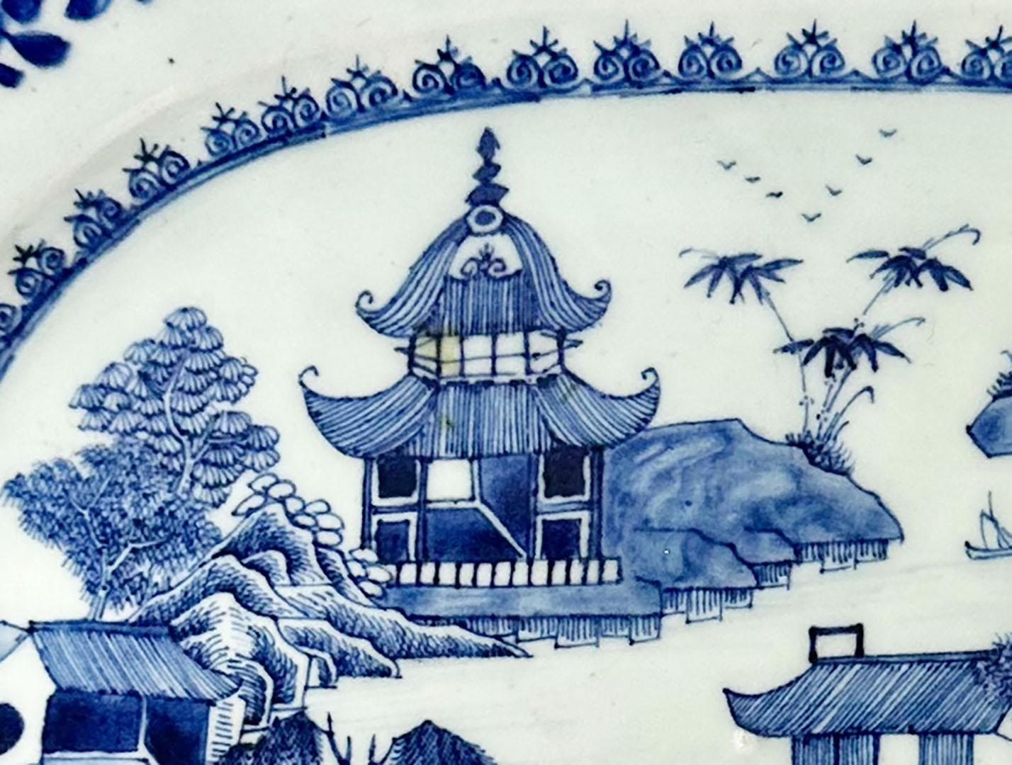 The timeless elegance of this early 19th century Chinese export blue and white Canton platter is a testament to the rich history of Chinese ceramics, capturing the essence of the Canton style popularized during the 18th and 19th centuries.