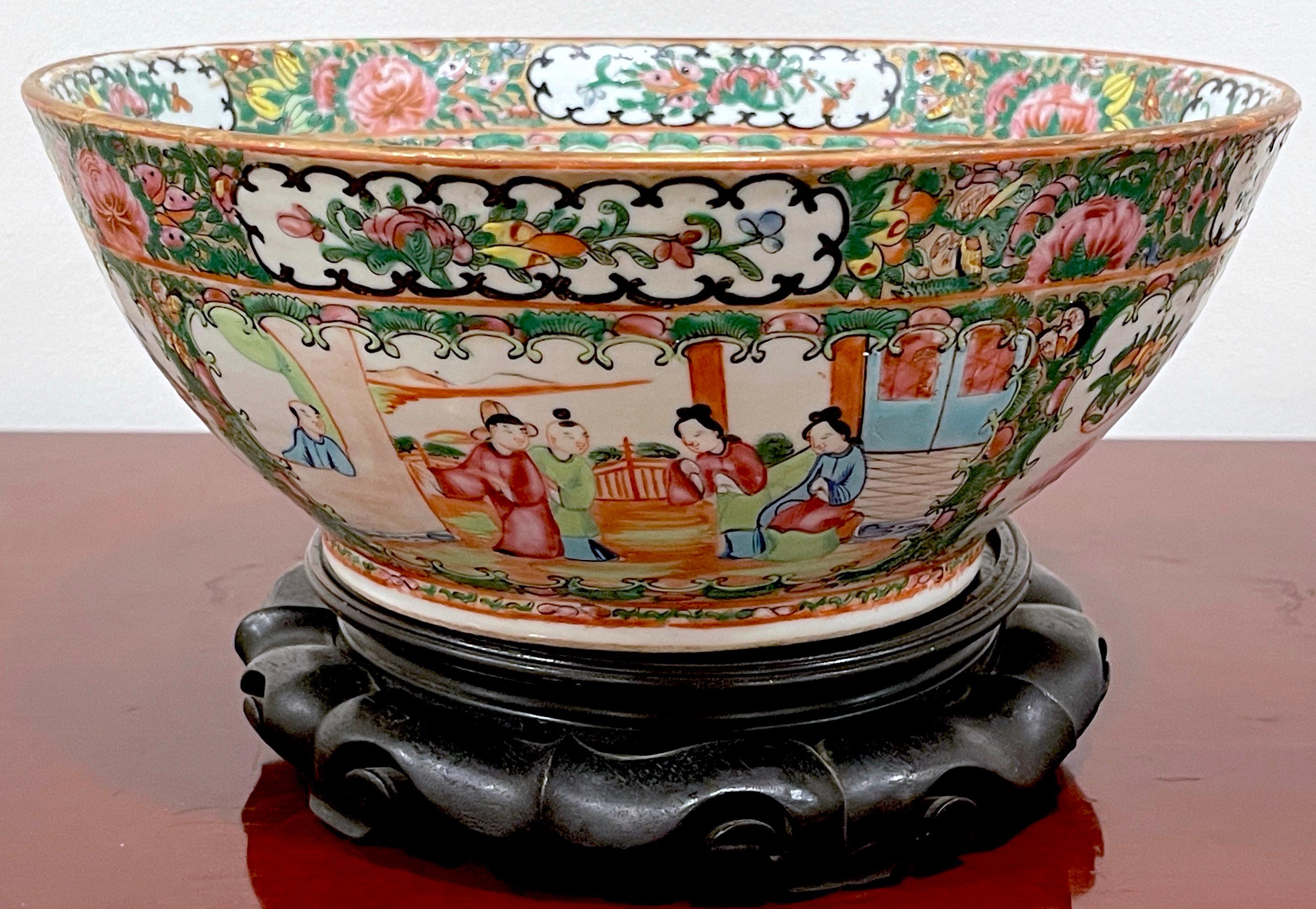 19th Century Chinese Export Rose Medallion Bowl & Hardwood Stand
China, circa 1880s, Later carved hardwood stand 20th Century 
Of  good size, bright and colorful, hand painted and enameled  in the typical palette with gilt decoration. 
Complete with