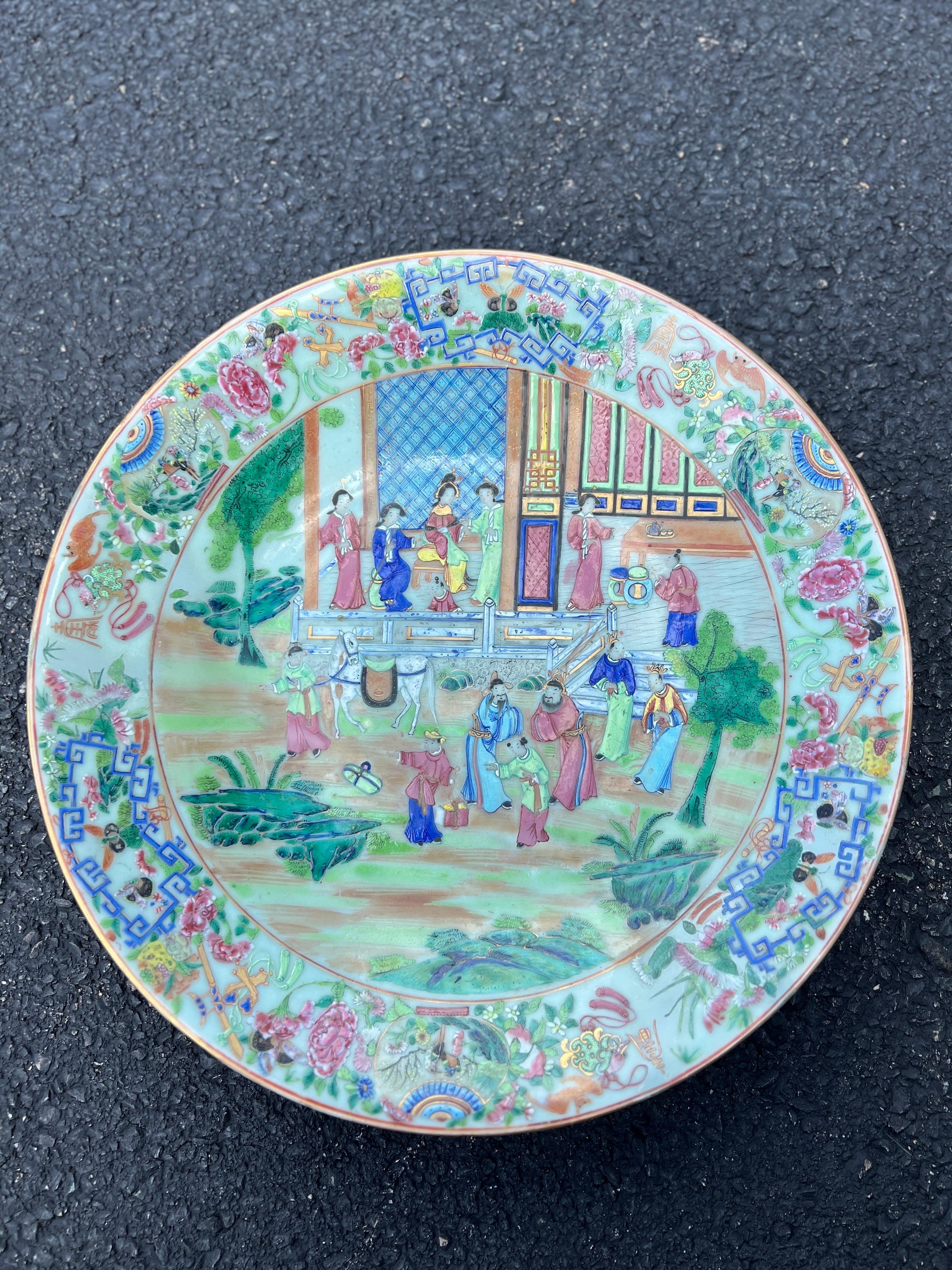 19th Century, Chinese.
This wonderful large platter features enamel painted imperial courtyard figural scenes to the center, vivid butterflies, bats, auspicious symbols, flowers and precious objects to the exterior rim. All hand decorated on a