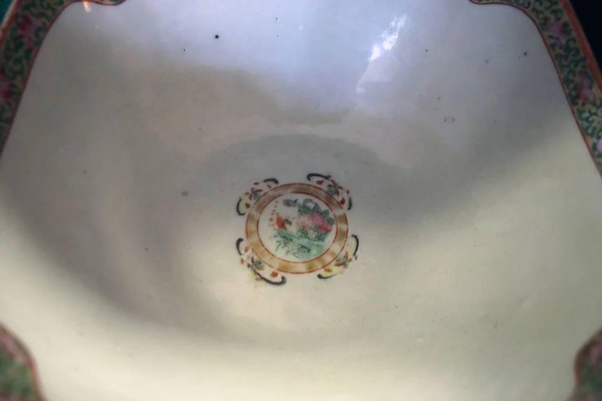 Chinese Export rose medallion serving bowl features unusual scalloped edges in four parts with beautiful birds, butterflies, fruit and floral decoration. Lovely detail. See measurements below.
