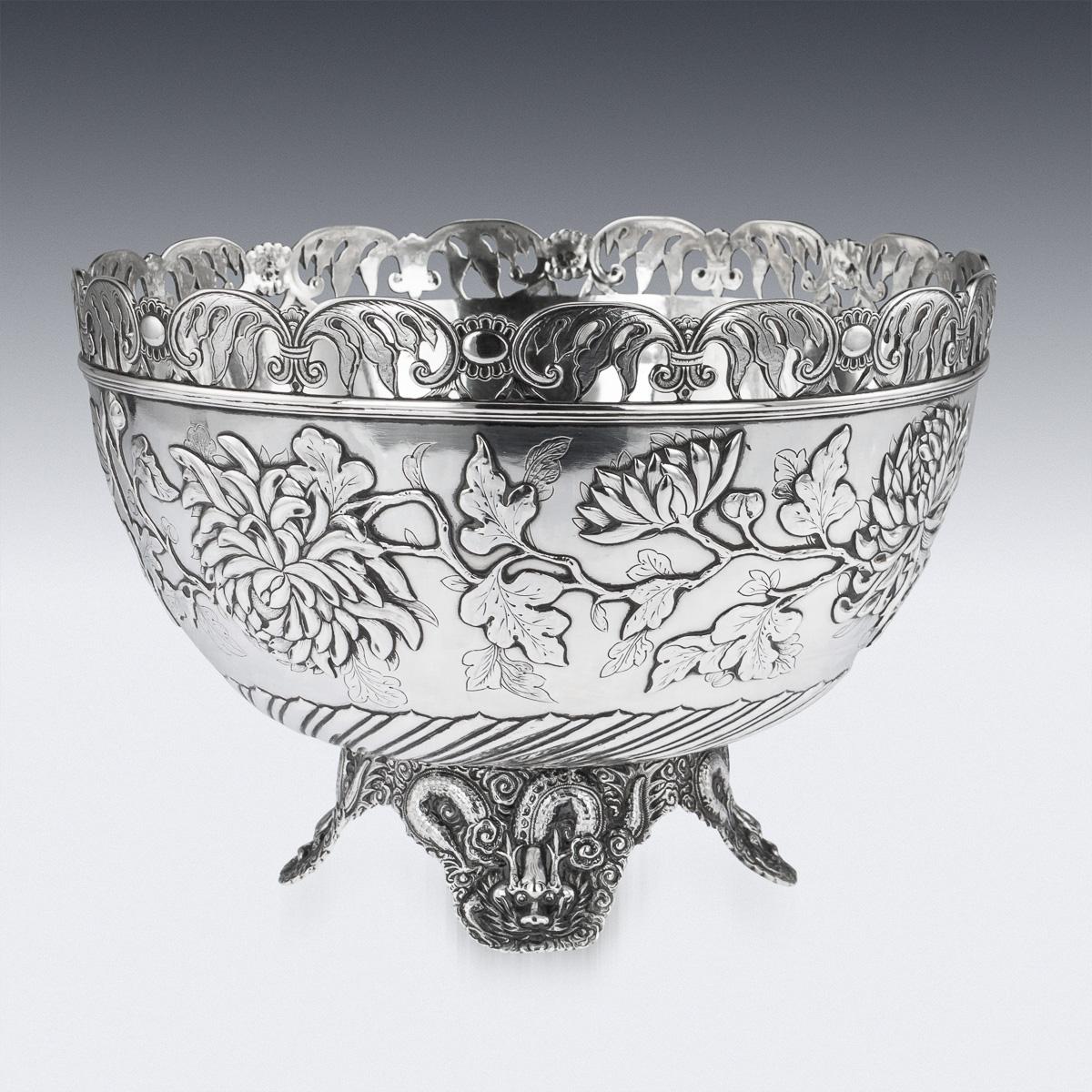 Antique late 19th century Chinese solid silver decorative fruit bowl, of traditional round form, applied with a shaped arched and pierced rim with flouted decoration along the bottom. The decoration is crisp and detailed, decorated with a continuous