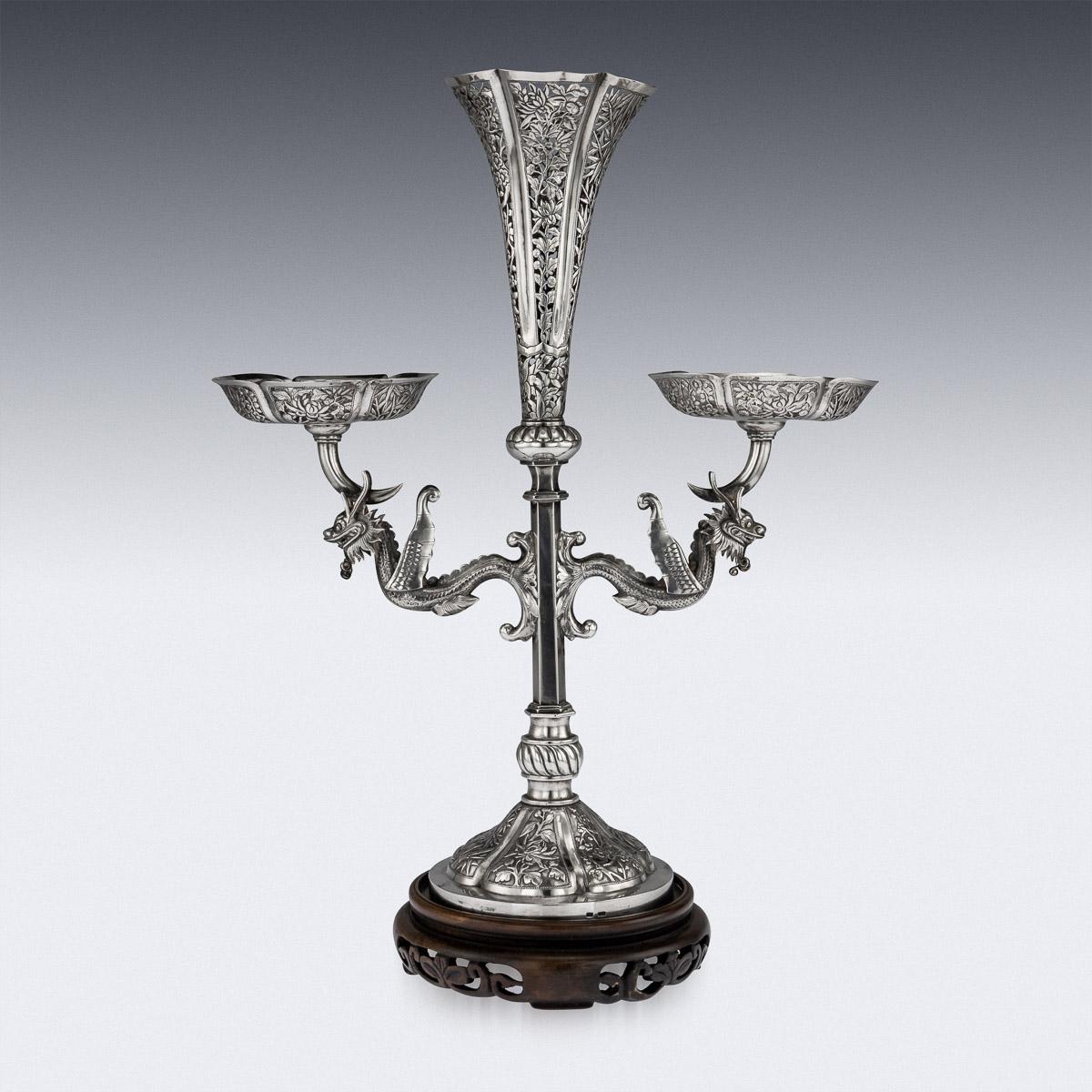Antique late-19th century Chinese very unusual solid silver eperne, the central trumpet shaped vase and twin baskets are highly decorated with pierced bamboo leaves, cherry blossom and chrysanthemums flowers. The stem applied with finely modelled