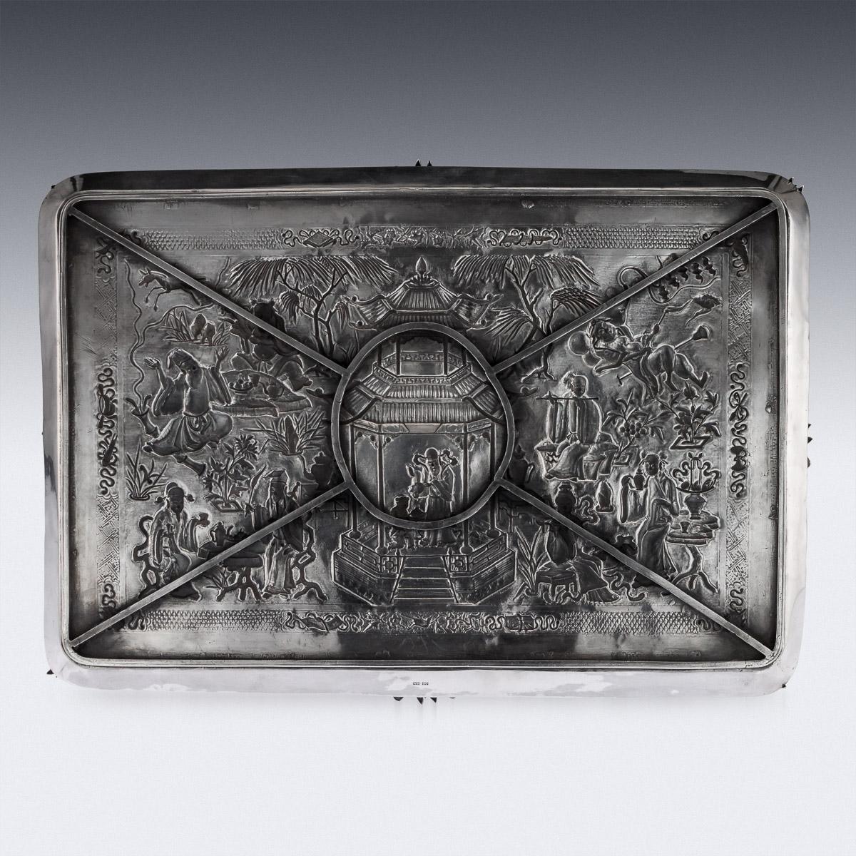 Antique 19th century Chinese exceptional solid silver cabinet / wall plaque, of large size, chased with beautifully scenes in relief depicting people of nobility enjoying activities of leisure amongst foliage, the center depicting a large pagoda,