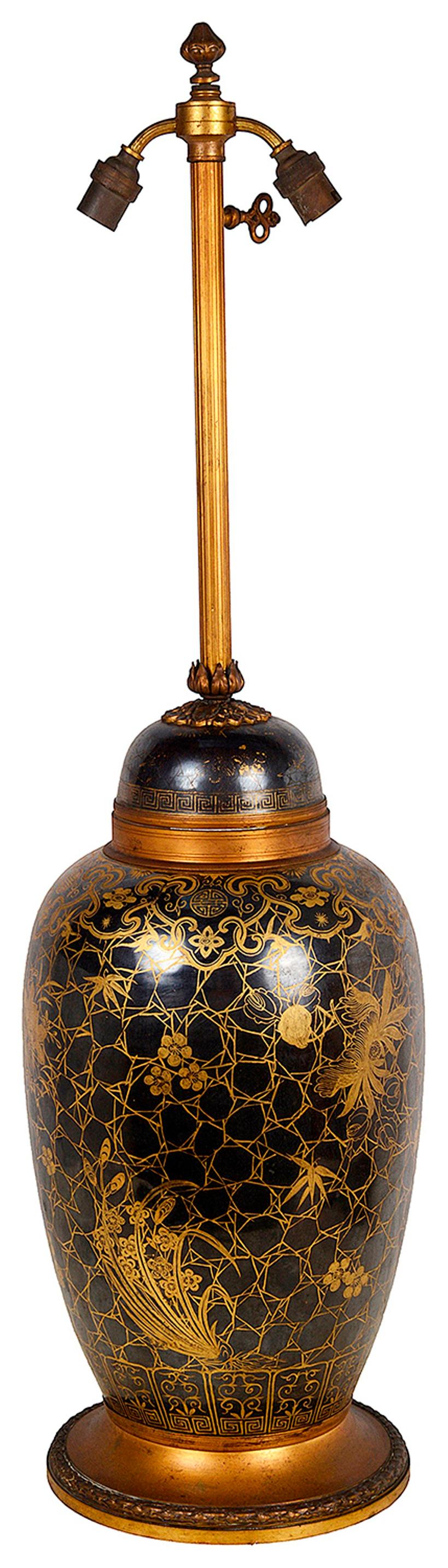 A very decorative 19th Century Chinese Famille Noure lidded vase with classical gilded floral and motif decoration to the whole. Mounted with gilded ormolu base and light fitting.