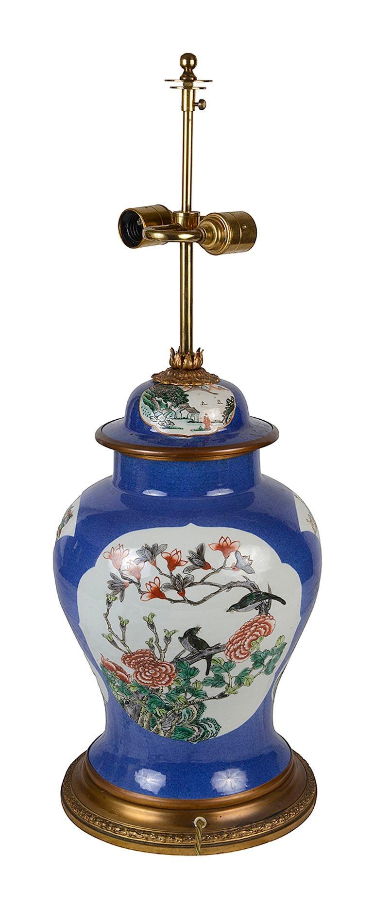 A striking 19th Century Chinese export Famille Verte porcelain vase / lamp, having a blue ground with inset hand painted panels depicting exotic birds and flowers, mounted on a gilded ormolu base.


Batch 76 N/H