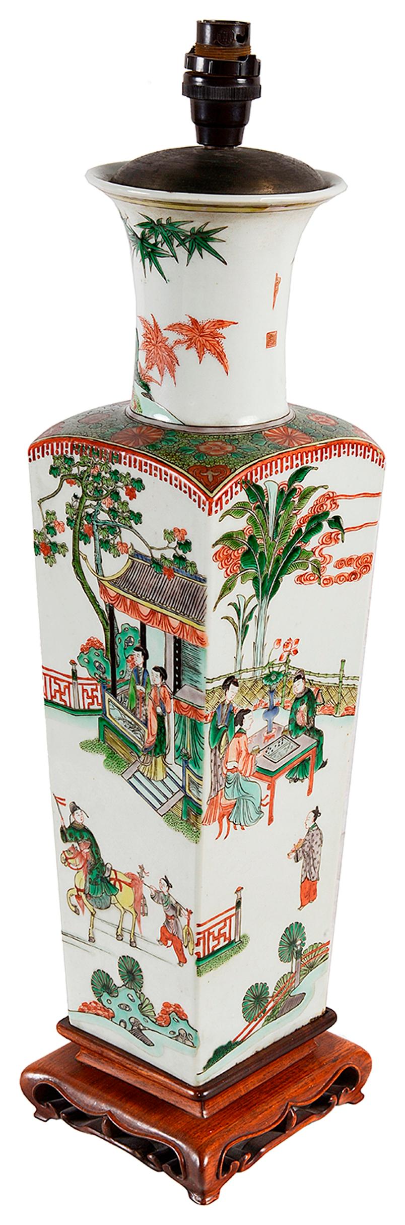 A very good quality 18th century style Chinese Famille verte vase / lamp. Having bold classical Chinese scenes of courtiers under pagoda buildings and in gardens playing games and on horse back. Mounted on a carved hardwood stand.