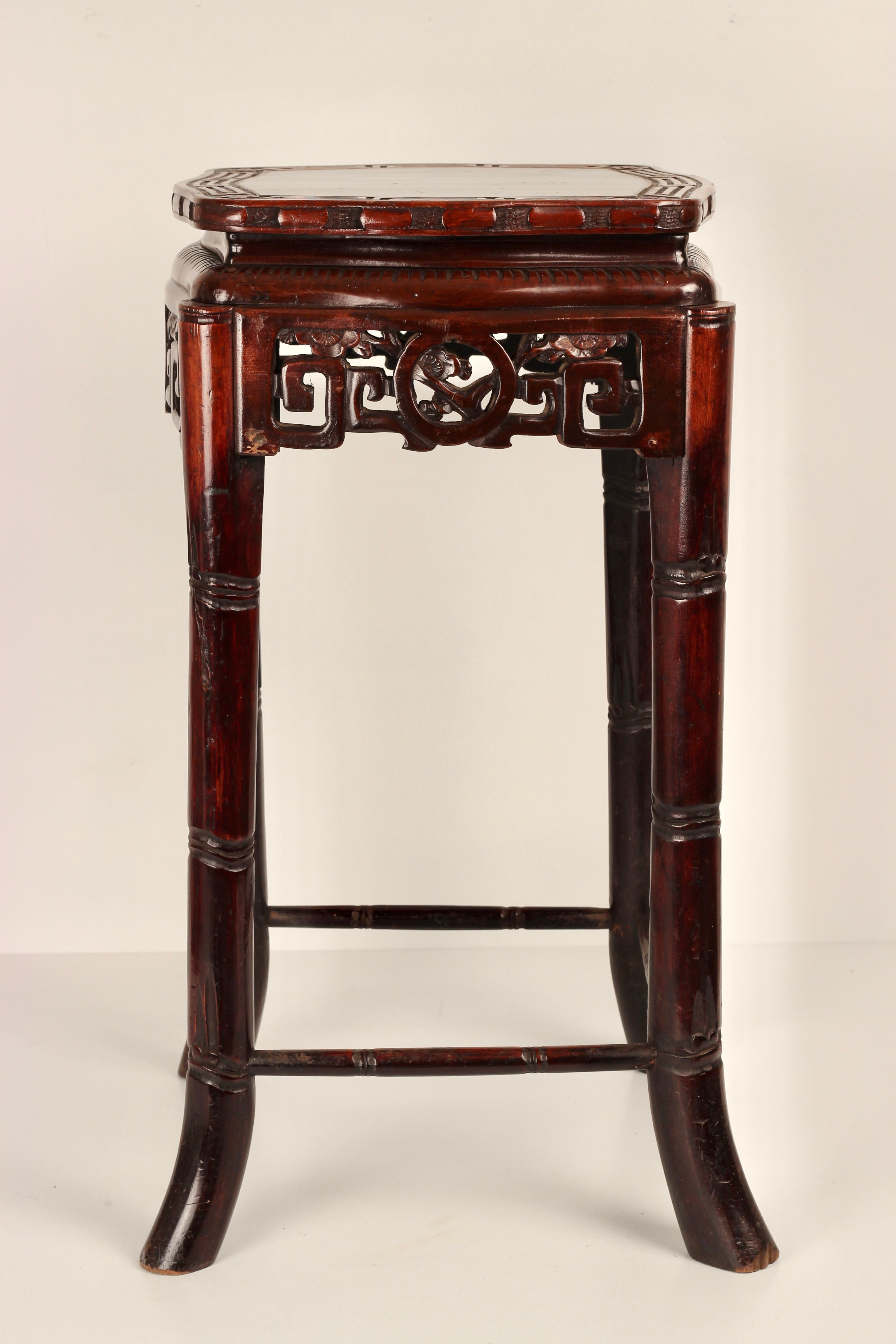 A Mid 19th century Faux Bamboo Tourchere in the Chinese style made from wood with a Rosewood colour stain finish. 

Around the middle of the 19th Century Chinoiserie came back into fashion with the Rococo Revival. This piece would work well in an