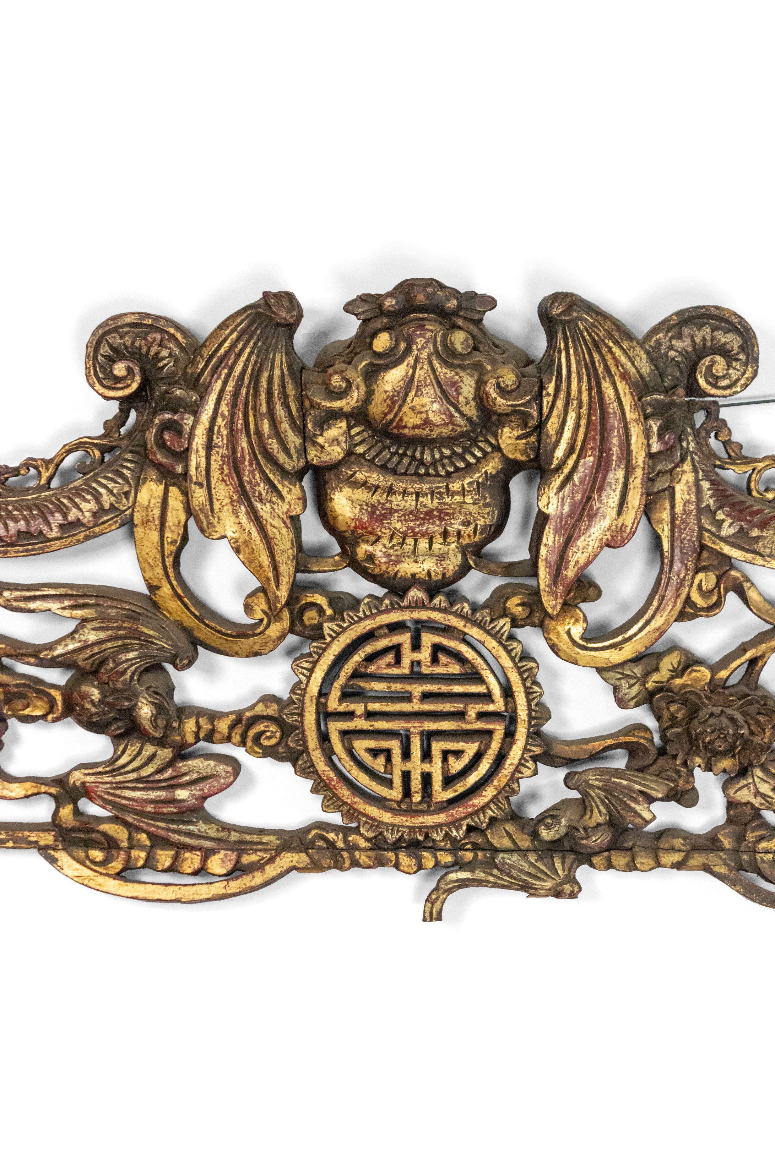 Asian Chinese style (19th century) red and gold painted filigree carved horizontal wall plaque.
 