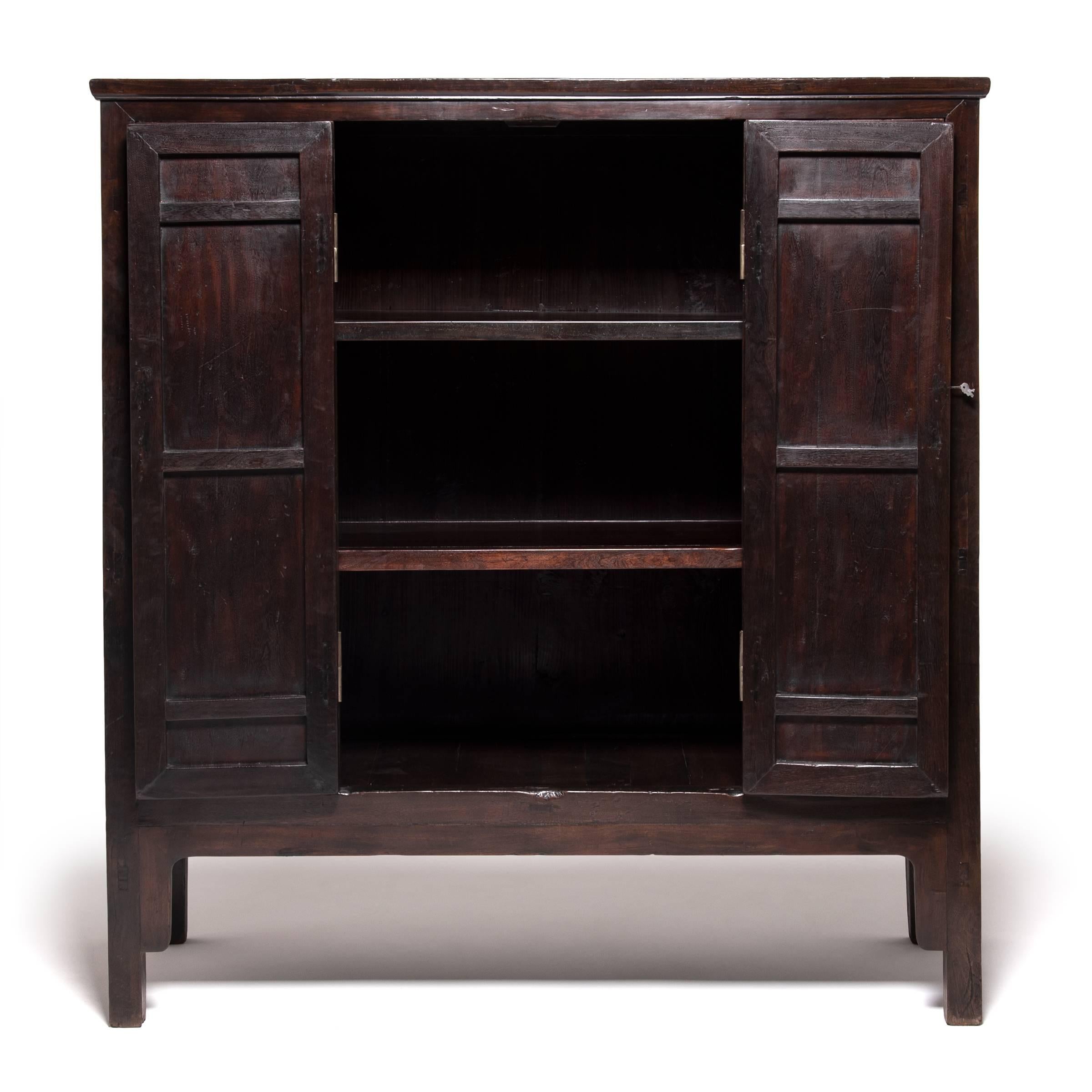 This very fine 19th century cabinet from Northern China is made of ironwood. Iron wood, known in Mandarin as Tieli and prized by collectors, comes from the tallest Chinese hardwood tree and is very durable with a coarse texture and distinctive open