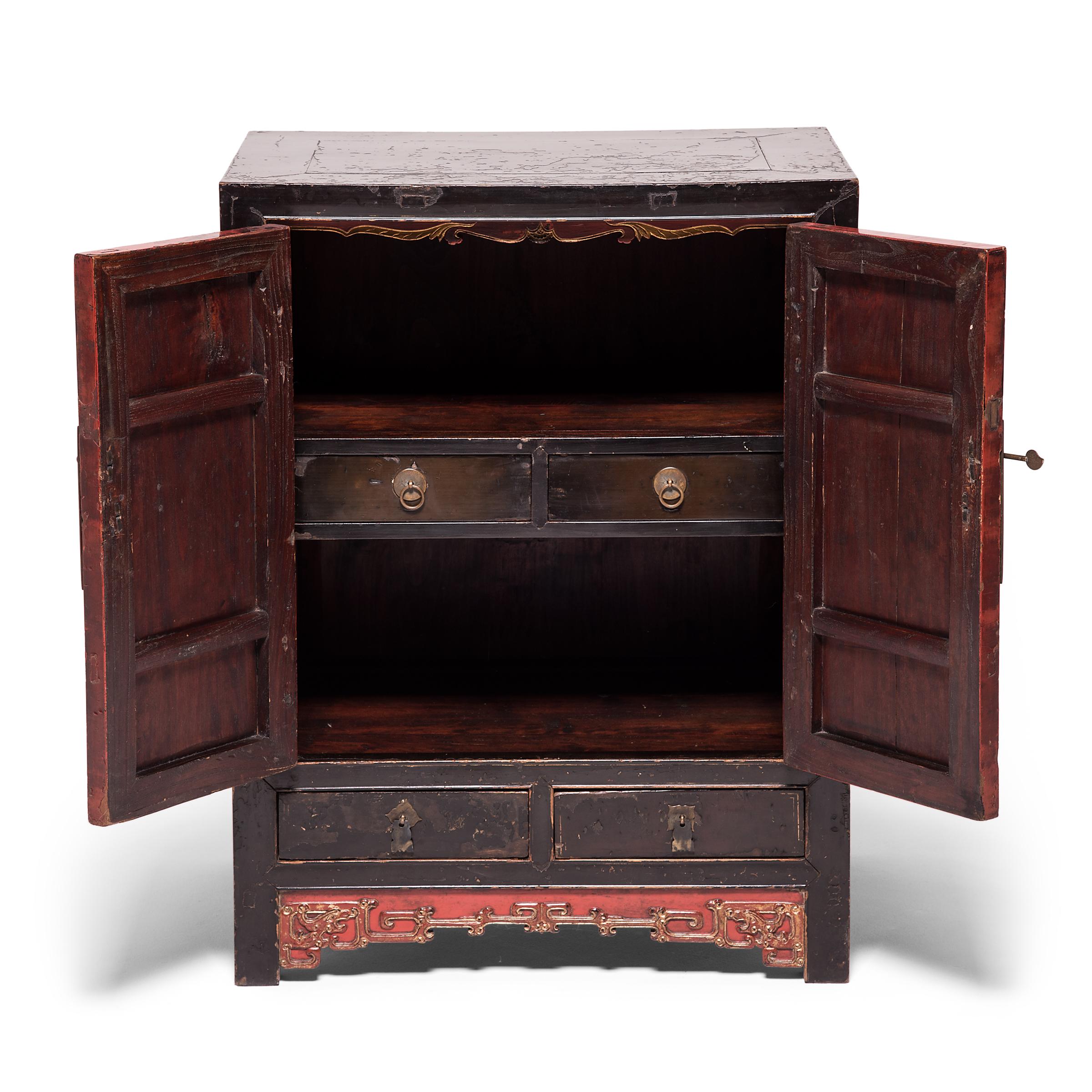 This stunning, ornate chest was masterfully constructed over 150 years by artisans in northern China. Although the design follows classic forms, vibrant decoration makes this chest unique. The paneled doors are cloaked in a brilliant red lacquer,